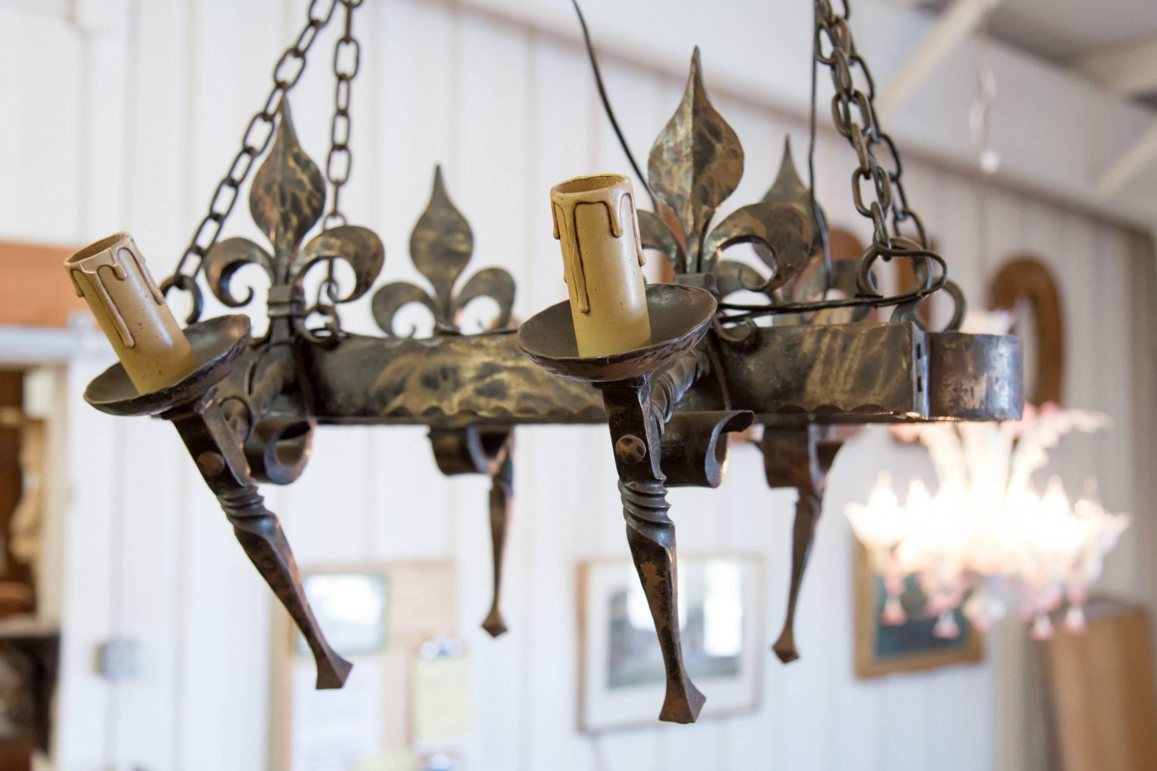 Country French Four Light Hand-Forged Iron Fleur de Lis Chandelier In Good Condition In Birmingham, AL