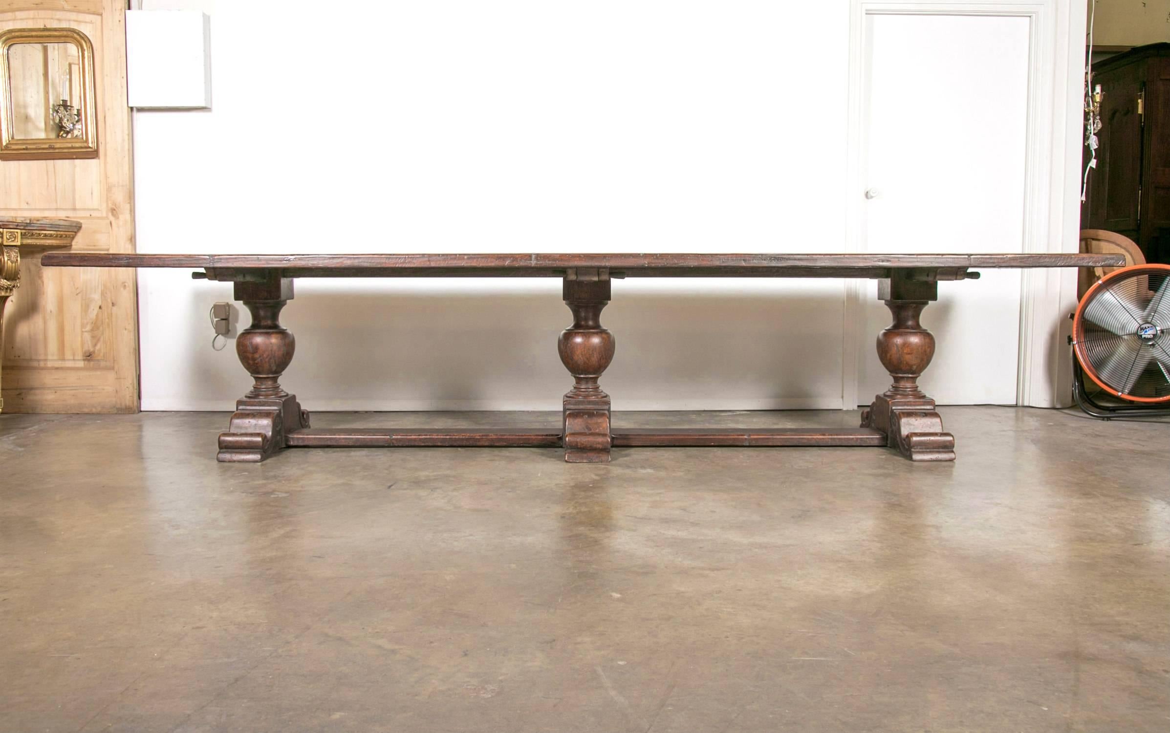 An exceptional early 19th century 13-foot French chateau trestle table, having a 2