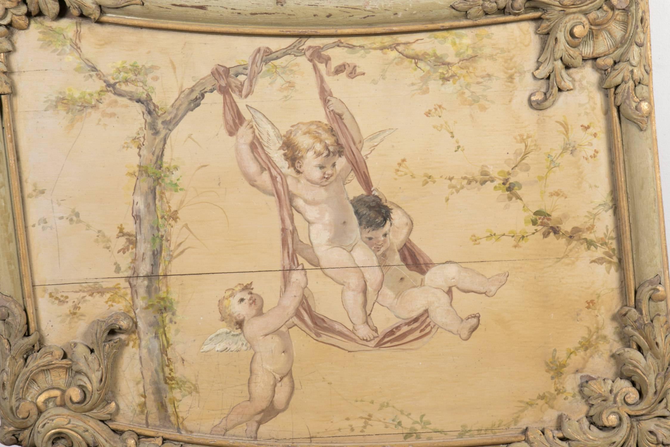 Rare and beautiful antique French carved parcel-gilt and painted boiseries panel with oil painting on board, once part of an entire boiseries (French wooden paneled room). The oil painting in the centre of this Louis XV style boiseries panel depicts
