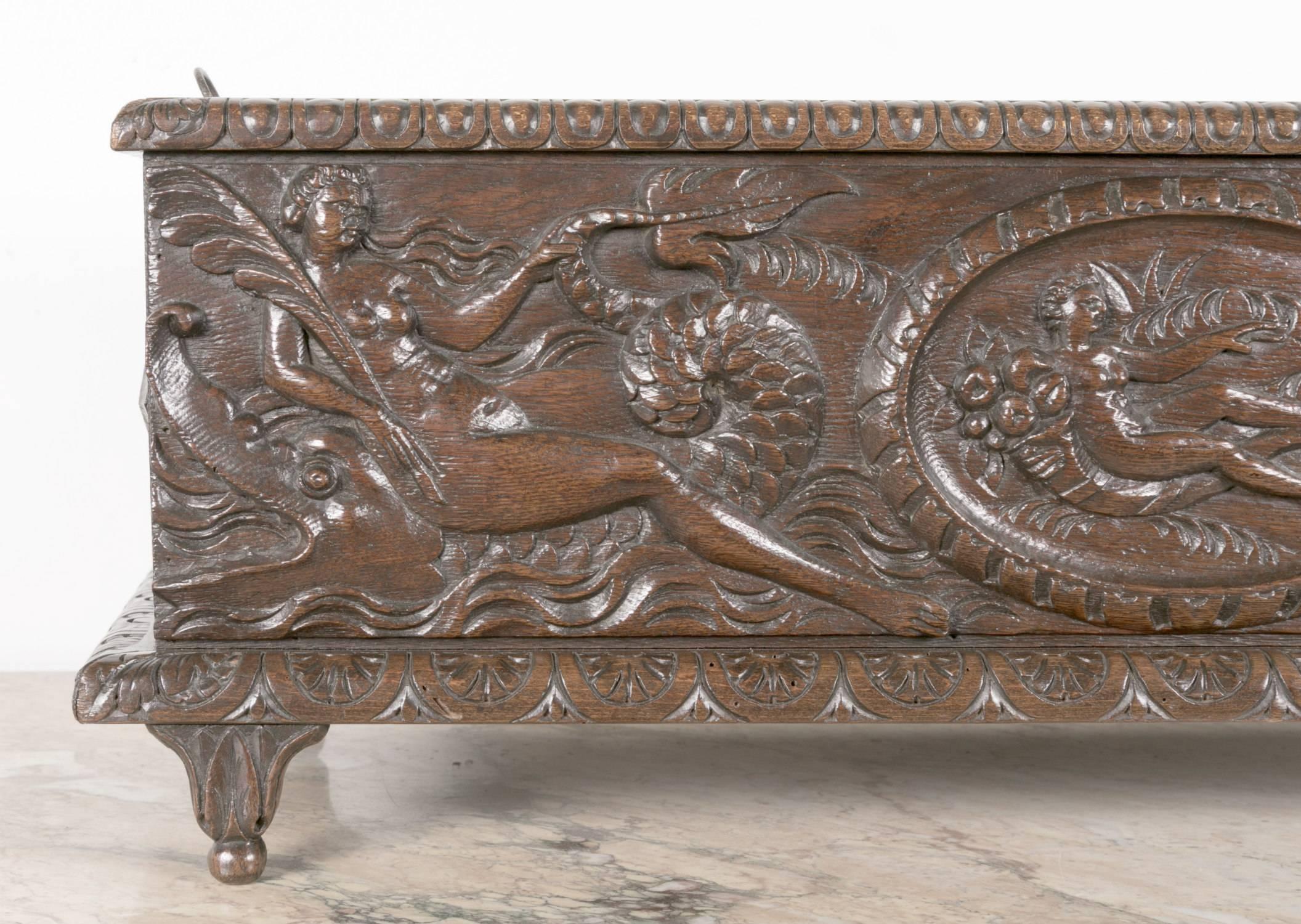 Fabulous 19th century hand carved solid oak French jardiniere, circa 1850. This large wood planter, in excellent condition with a rich patina, is carved on all four sides and features a center nymph with a horn of plenty flanked by sea nymphs riding