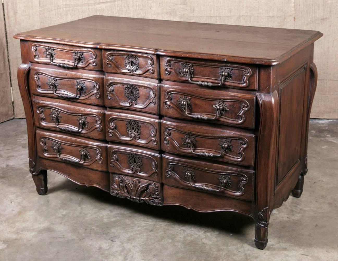 Rare 18th century period, French, Louis XV commode having three small top drawers over three single drawers with faux drawer facades. Original hand-forged iron handles and escutcheons adorn the fronts of each drawer. Sides are paneled and there are