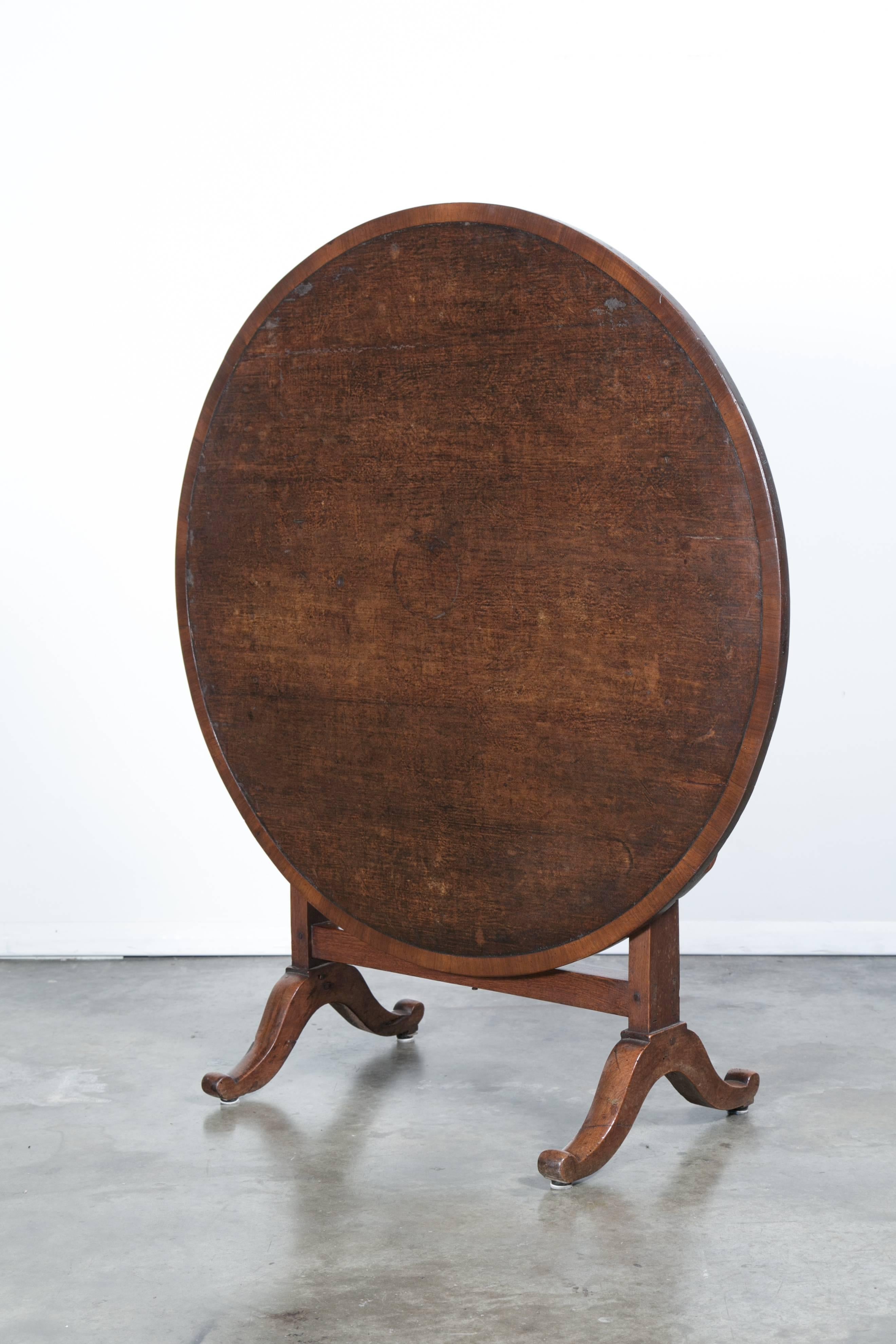 This French wine table with typical tilt-top dates back to the mid-1800s and features the original canvas top. Tables with canvas tops were used by vineyard owners for tastings, unlike the other tables used in the fields to feed the workers. This