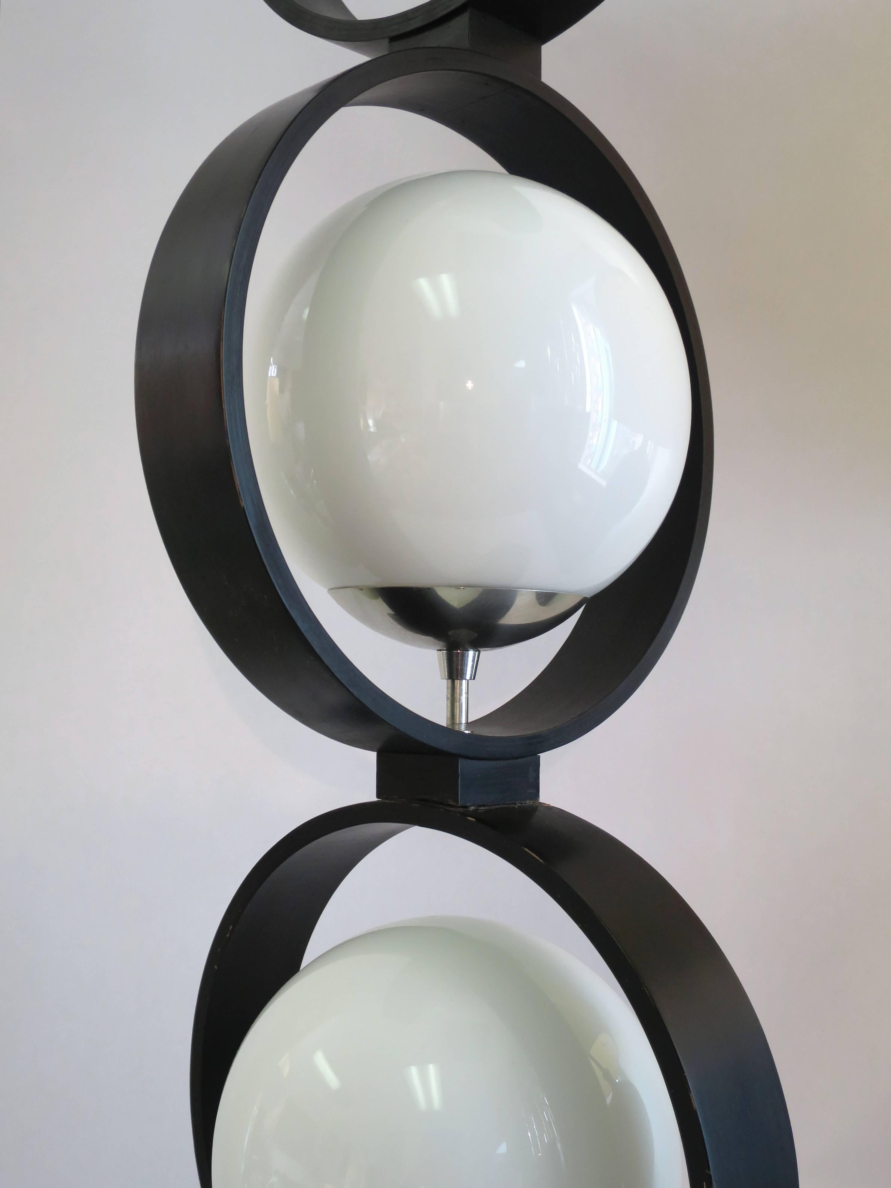 Black lacquered table lamp with frosted globes by Modeline, circa 1960s.