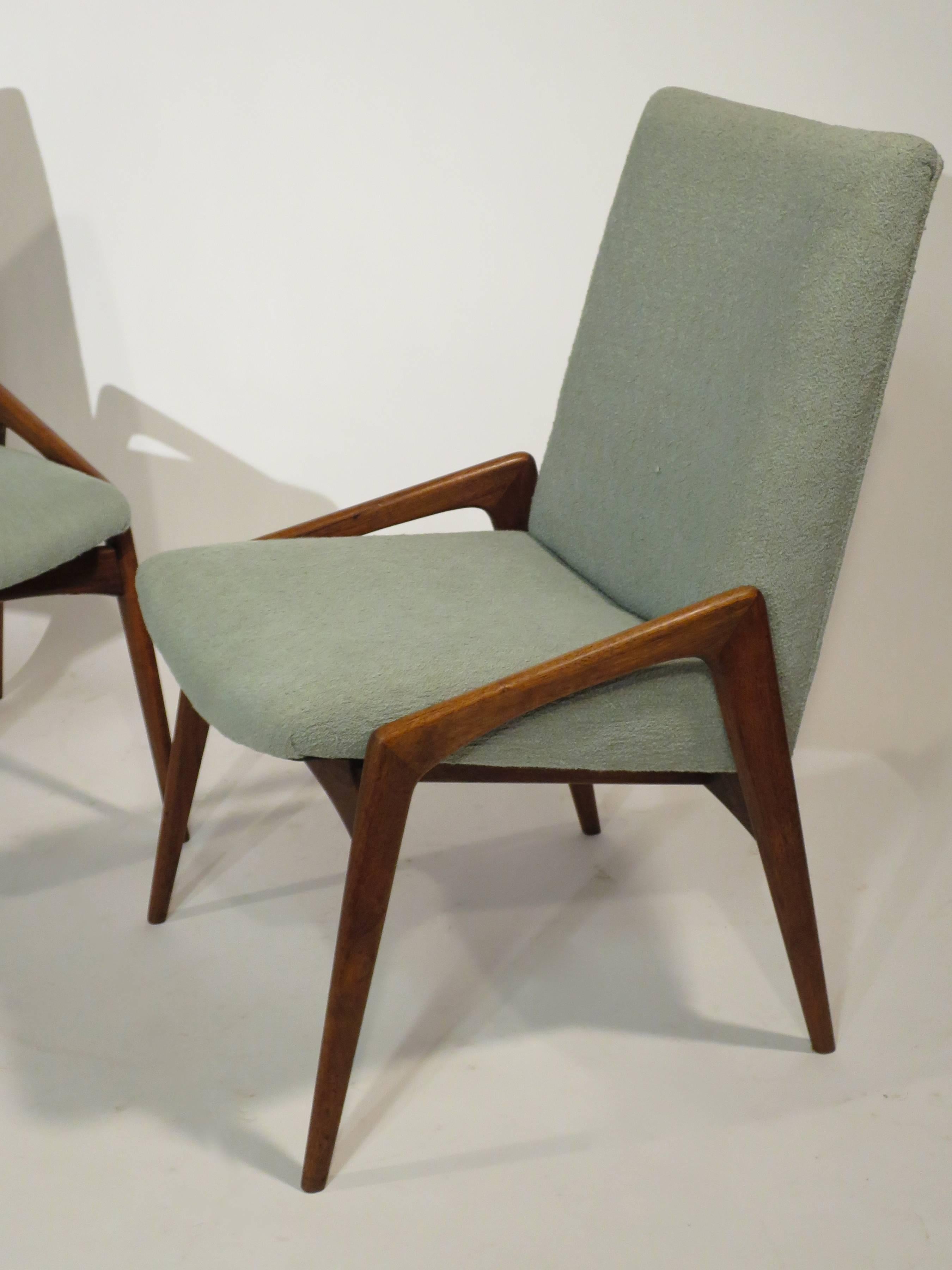 Set of four Mid-Century dining chairs. Very nice condition with new upholstery, circa 1950s.