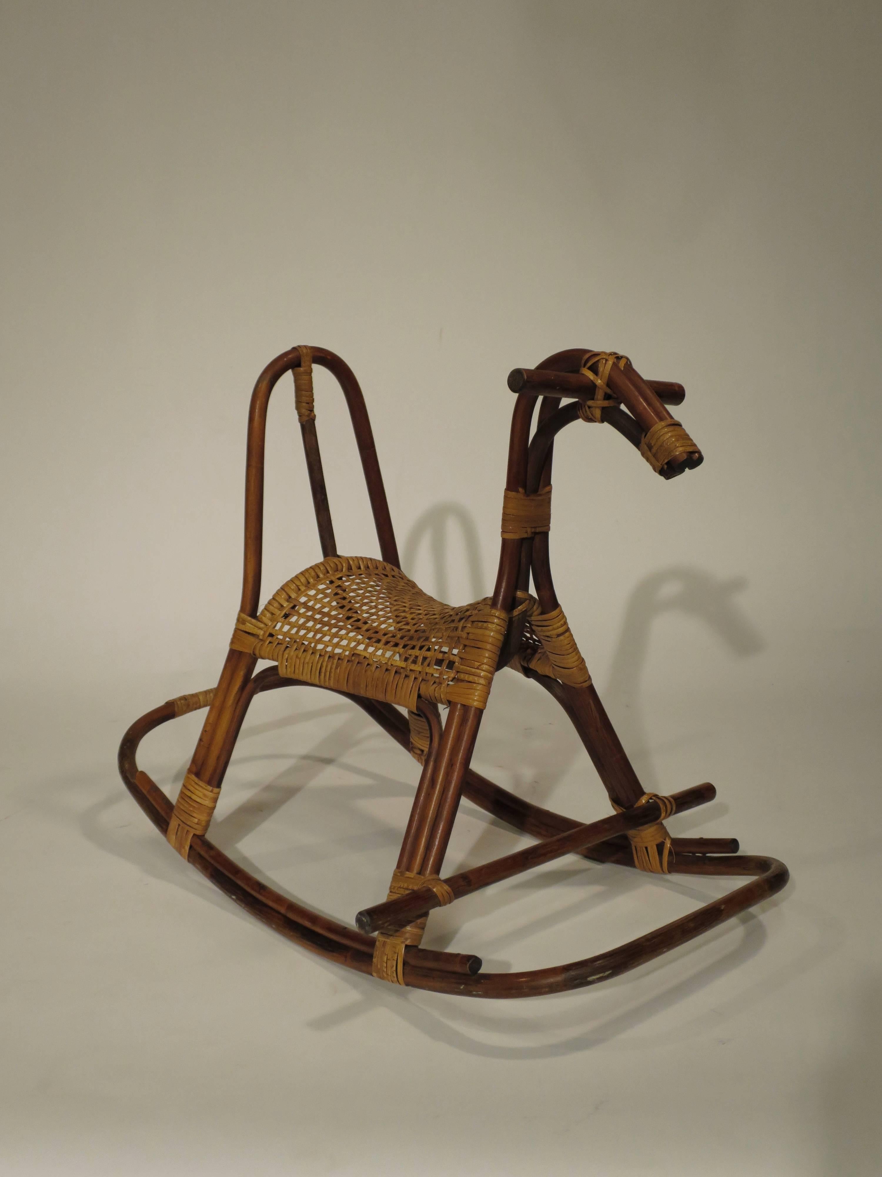 Mid-Century child's size cane and rattan rocking horse. Very nice condition. Made in Sweden, circa 1950s-1960s.