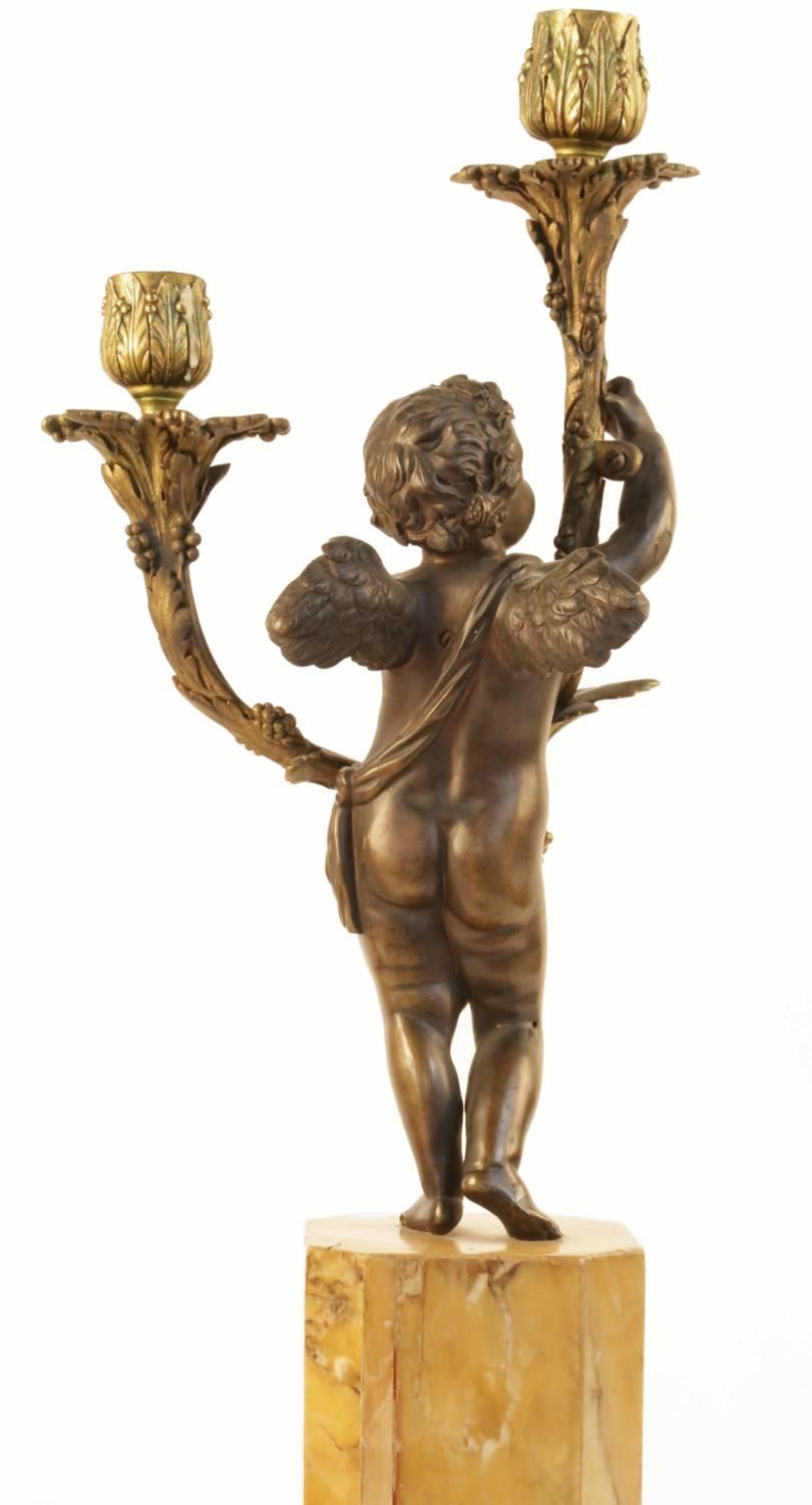 Gilt Pair of 19th Century Figural Cherub Two-Arm Candelabra