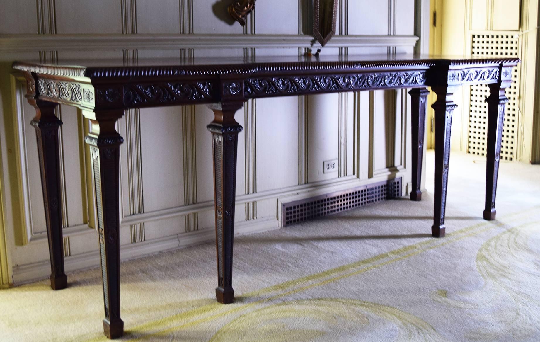 In George III style, of inverted breakfront form, each with gadrooned edge and Vitruvian scroll frieze, the six square tapering legs with bands of fluting, paterae and leaves.

Provenance: Roundwood Manor, Hunting Valley, Ohio
 