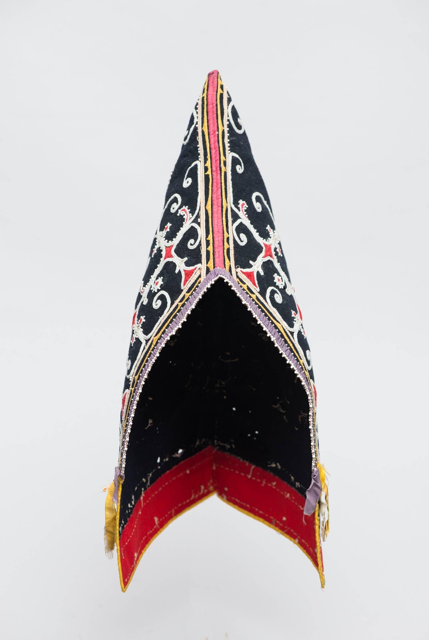 Region / Tribe: Northeast woodlands/ Maine-Nova Scotia MicMac

circa 1830-1860.

Material: Black and red woolen stroud cloth, silk ribbon, tiny glass beads, silk threads.

Dimension: H. 14” x W. 7 1/2” .

Condition: Overall Excellent - one