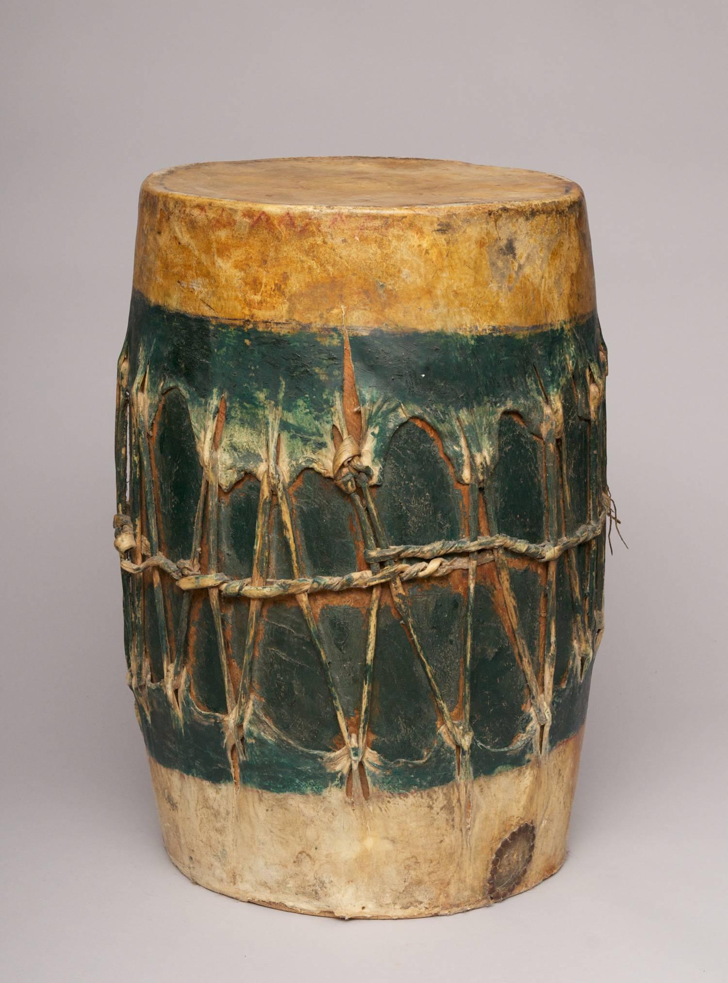 Pueblo Dance Drum

Region / Tribe: Arizona / attrib. to the  Hopi 

Circa: 19th Century

Material: Wood staves, hide drum heads with thick hide lashing, green paint

Dimension: H. 23 1/2” x Dia. 16”

Condition: Overall excellent with