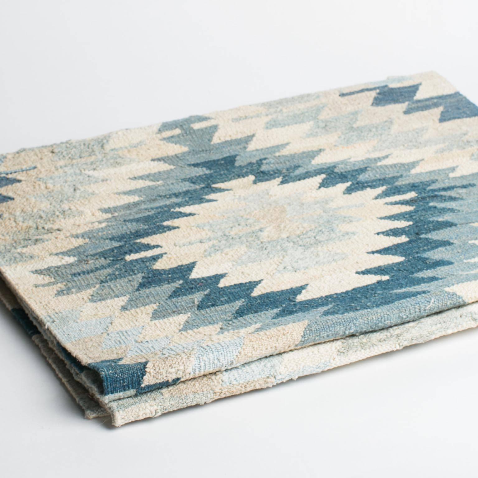 A gorgeous Turkish Kilim constructed completely from vintage wool, giving it a vintage edge with a modern twist. Perfect for a hallway, entry or any space with in need of a long runner. This rug is absolutely stunning-a wonderful blend of old