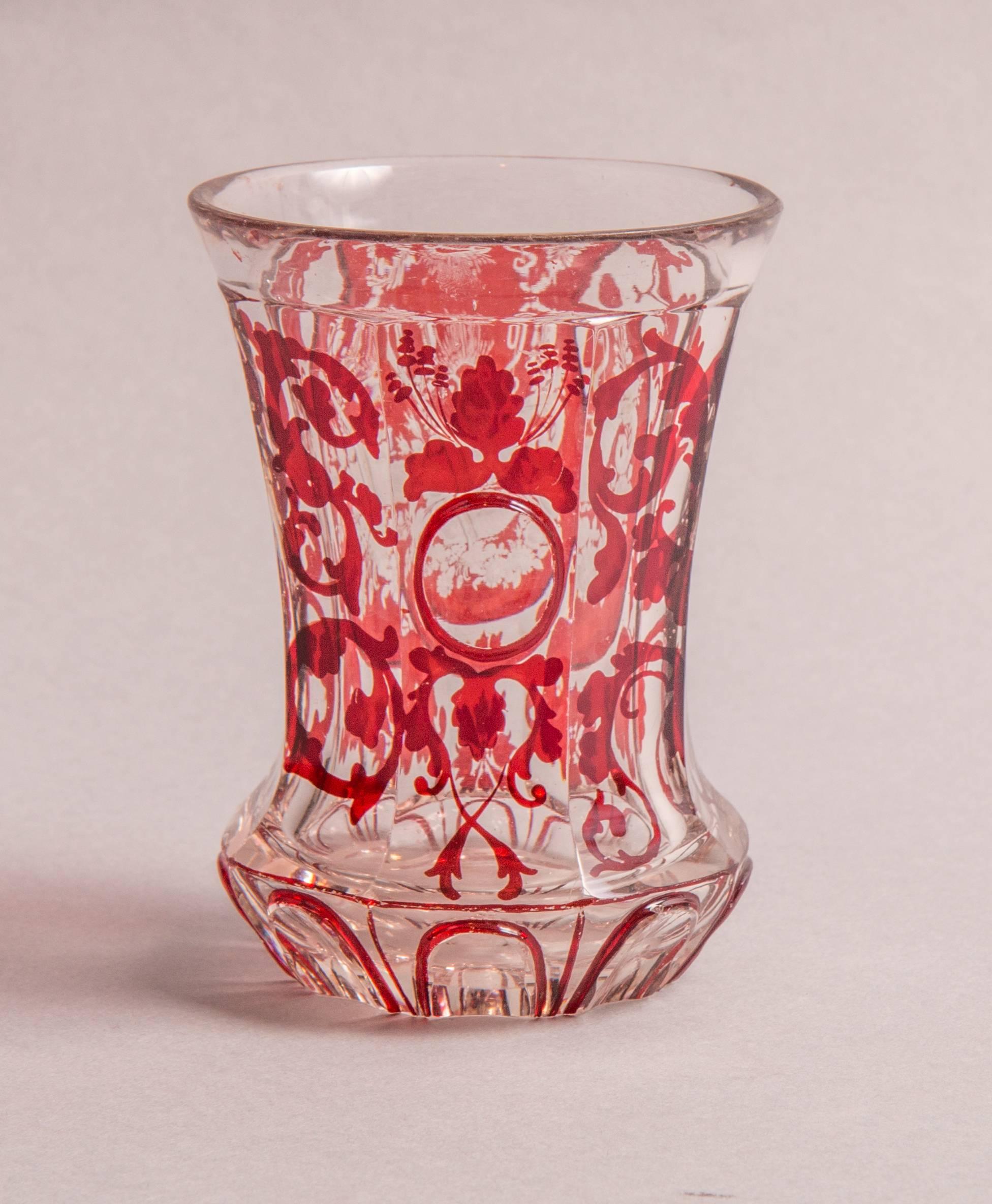 Bohemia, circa 1830-1850.
Clear glass, red enamel painting, stained medallion, cut cornucopia.