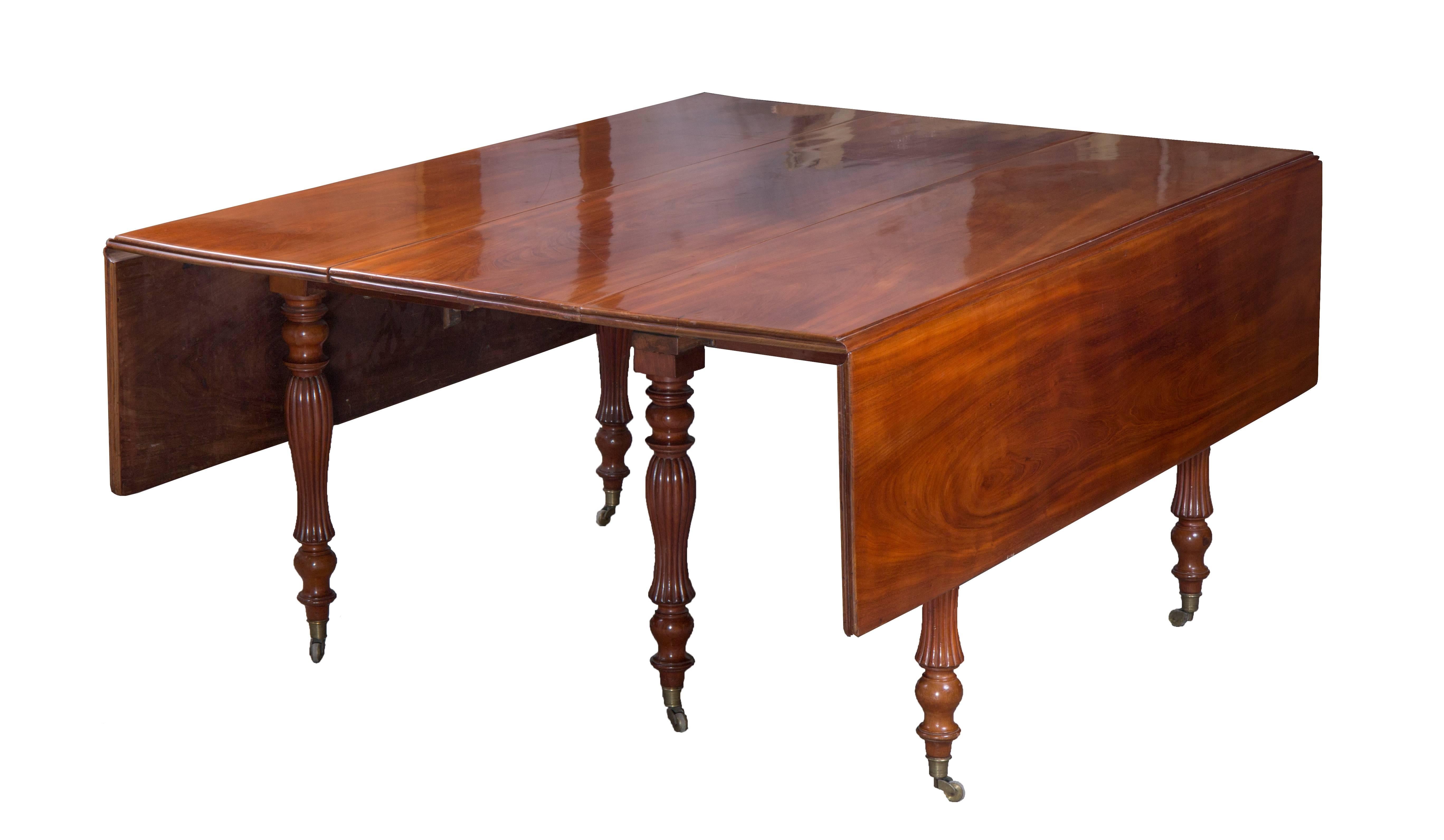 Mahogany veneered, height: 70 cm, extendable with extra leaves to 515 cm.
Edges moulded, legs sophisticated turned with brass endings, fold down, with two extra leaves.  