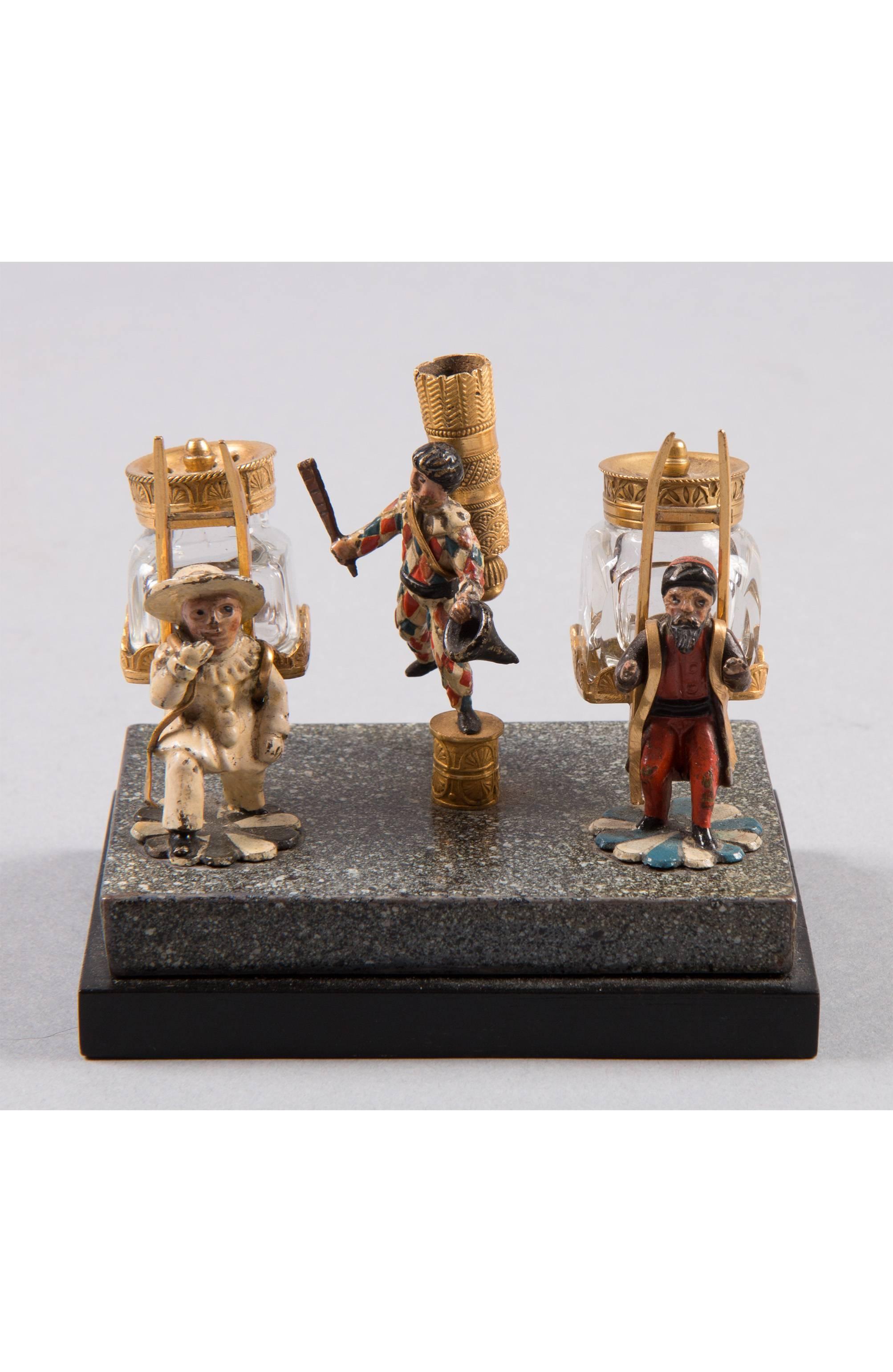 Two small ormolu and cold painted bottle inkstand
Vienna, circa 1810
With three figures on a marble and wooden base
Measure: 3.5 inch wide.