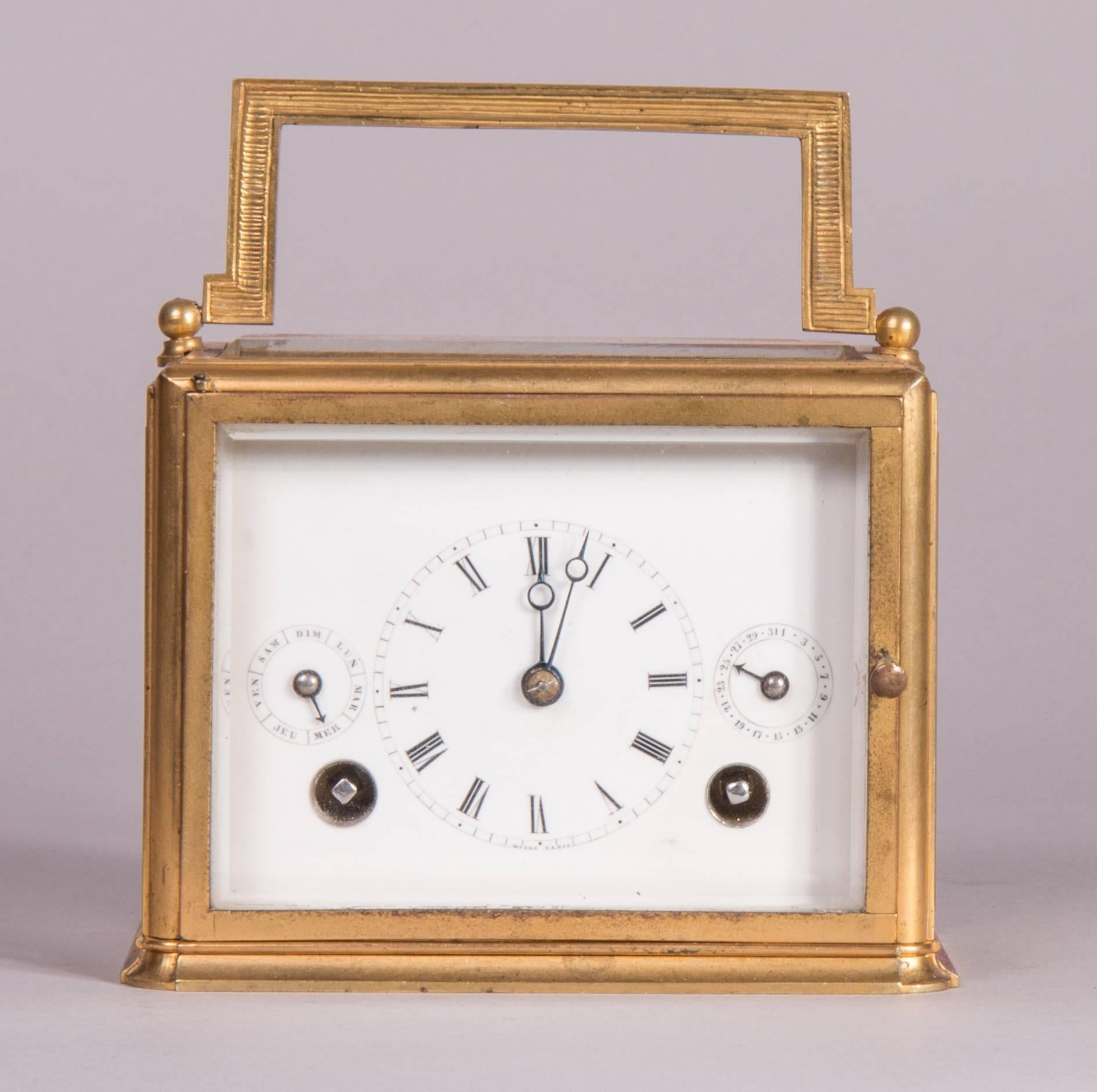 Signed "Moser Paris".
Gilt brass case, enamel dial, indication of date and weekdays, blued steel hands, twin spring barrel movement with outside count wheel strike on coiled steel gong.
Engraved on the rear door: “This clock was