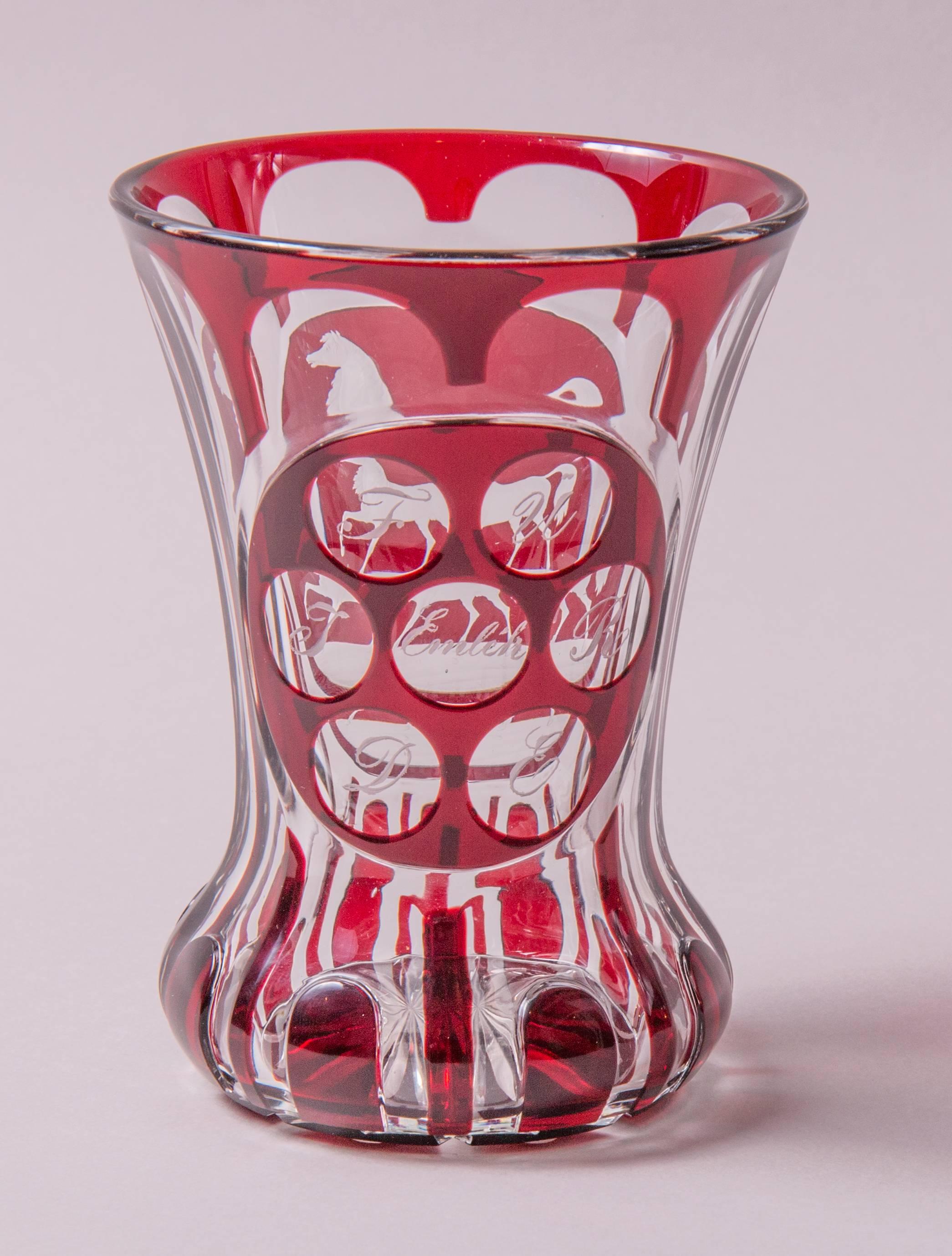 attributed to Karl Pfohl (1826–1894)
Harrach’sche Hütte Neuwelt, Steinschönau, North Bohemia 
Colourless glass with red overlay, the facing side with cut image of a horse, the reverse side with seven cut lenses with dedication: „FÜR EDJ