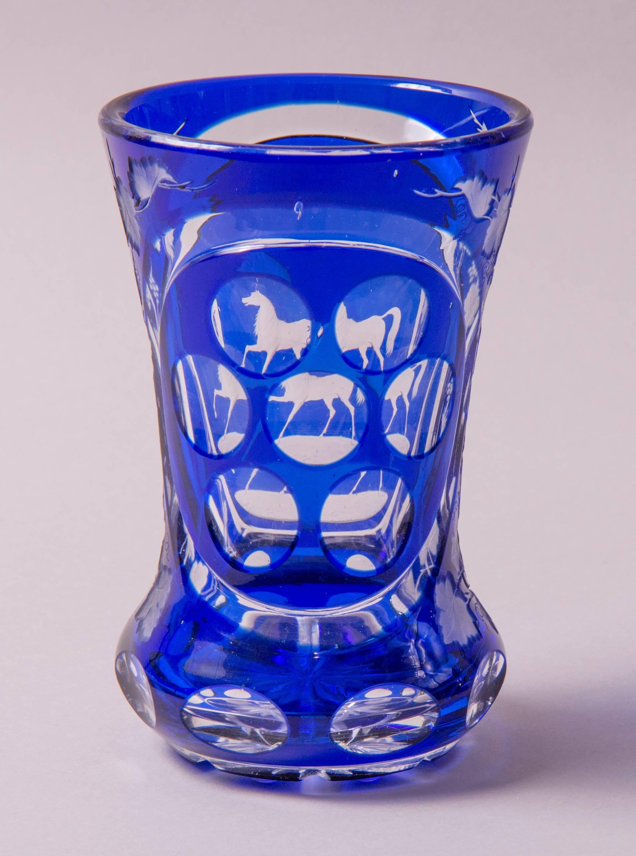 Attributed to Karl Pfohl (1826–1894)
Harrach’sche Hütte Neuwelt, Steinschönau, North Bohemia
Colourless glass with blue overlay, the facing side with cut image of a horse and on the sides of vine branches, the reverse side with seven cut