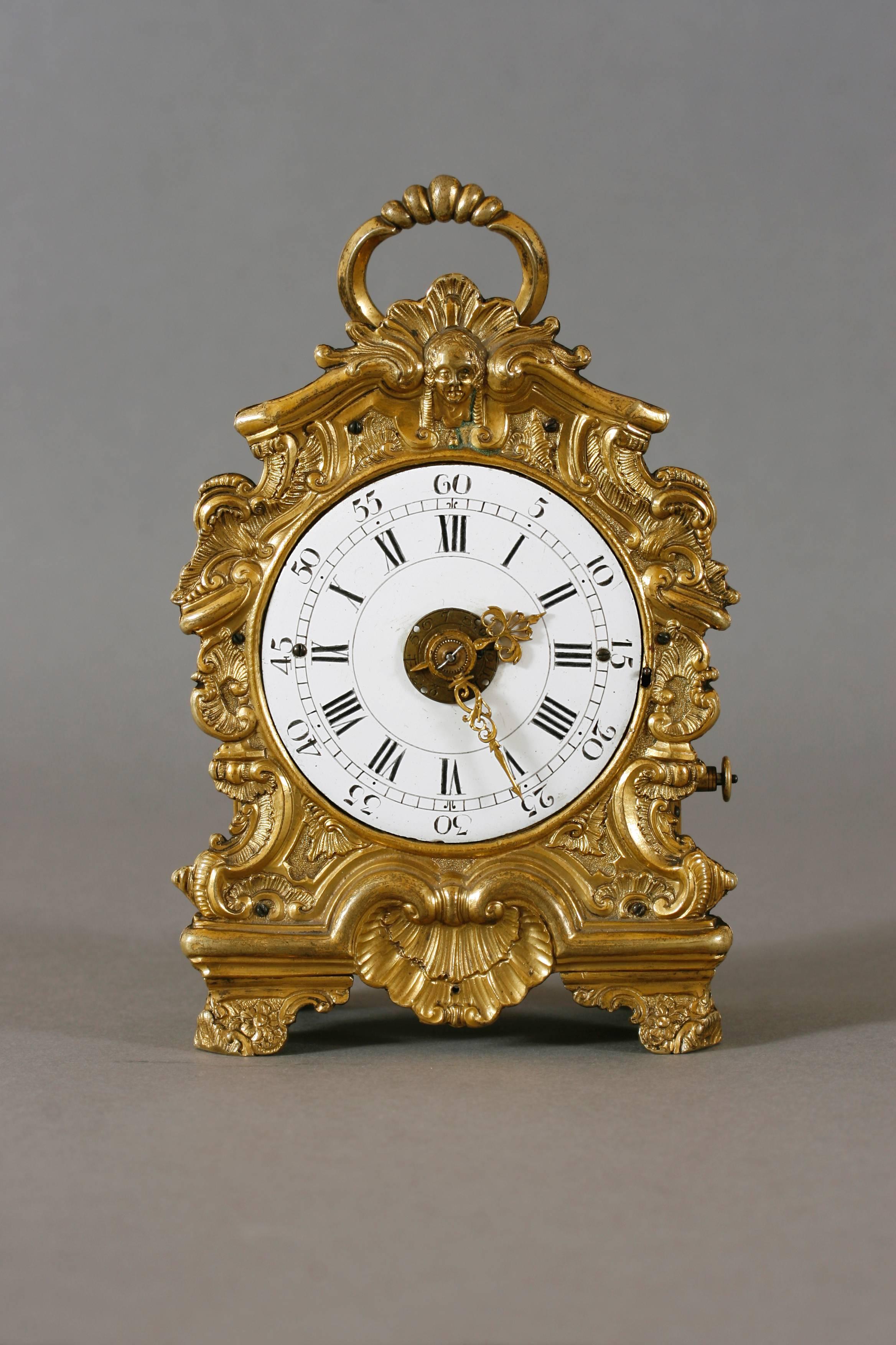 Signed on the back plate: "Jacob Guldan Pressburg" (Bratislava).
Height: 5,3'' (13,5 cm), duration: one day
Fire gilt brass case with engravings on all sides, partly embossed and chased, glazed on both sides, cast bow handle, enamel