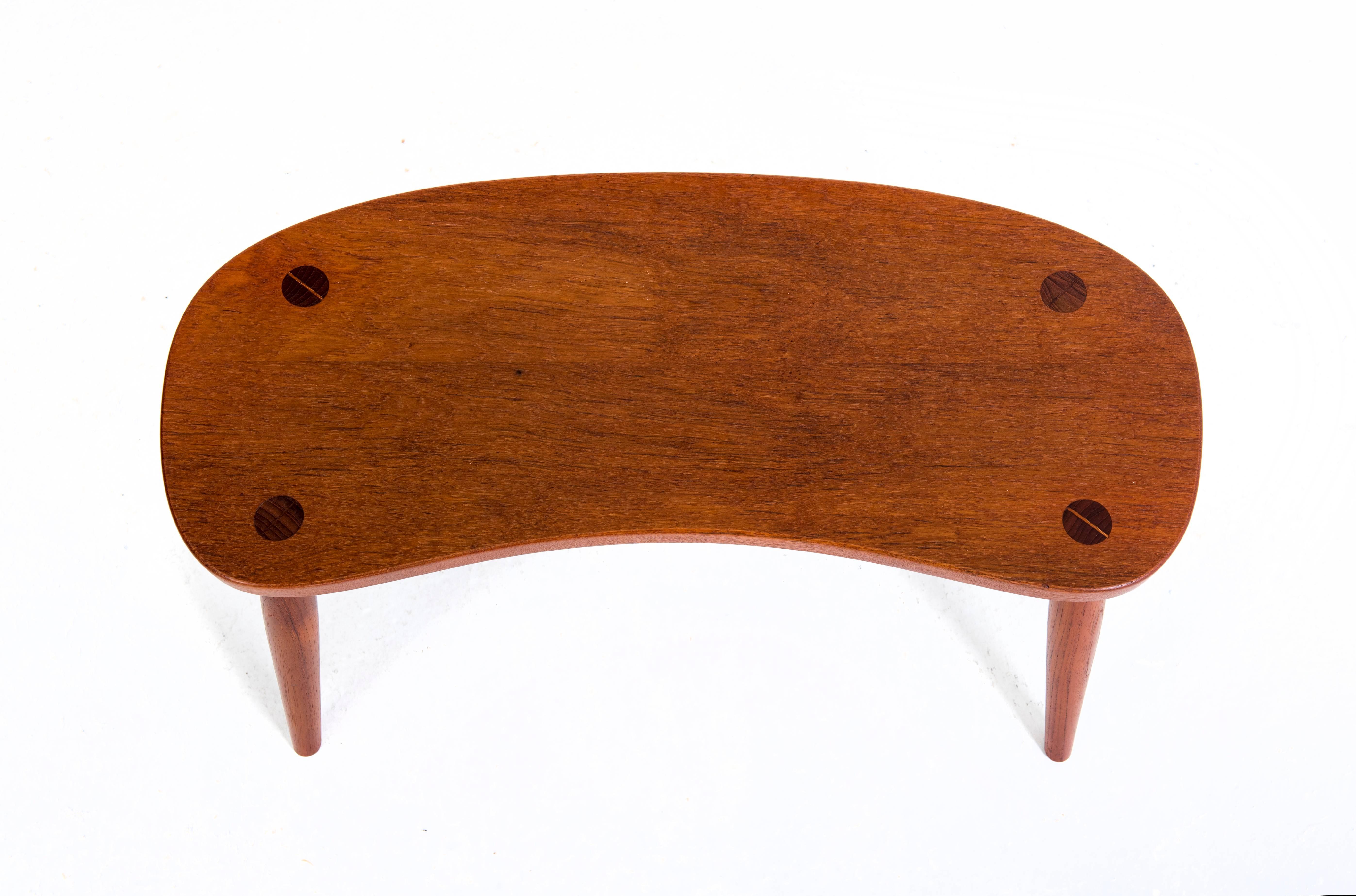 Josef Frank.

Solid teak stool.

Made by Svenskt Tenn.

