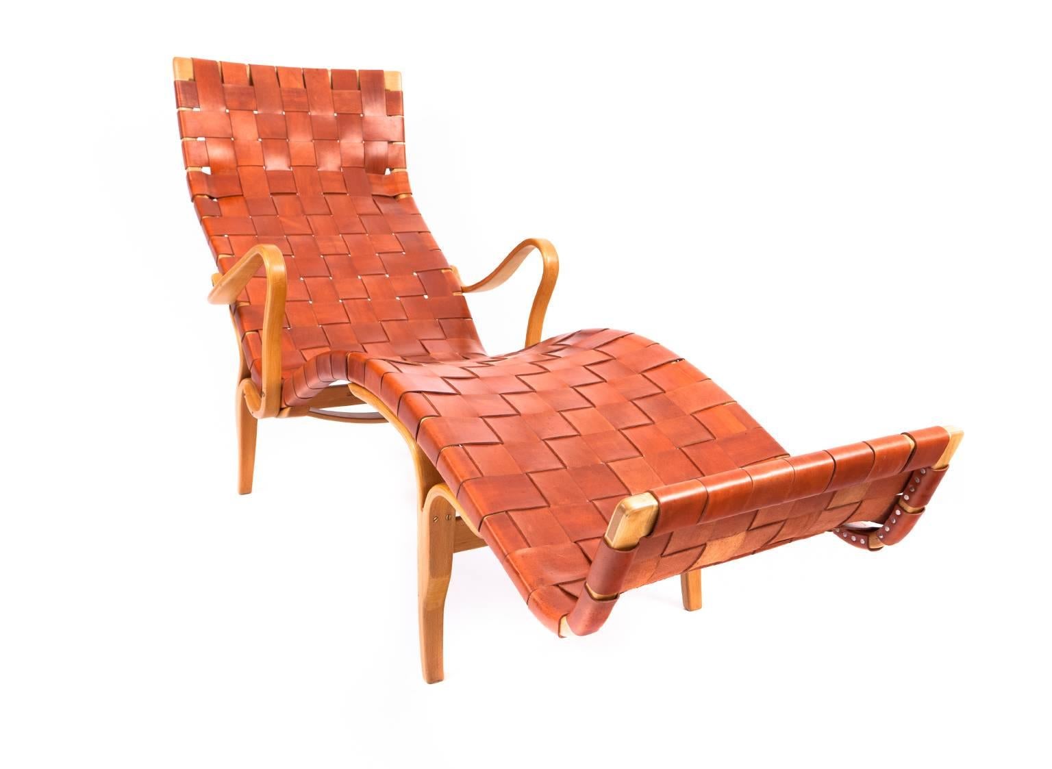 Bruno Mathsson 

Pernilla 3
Lounge chair of laminated beech. Seat and back with woven leather. 

Designed 1944.
