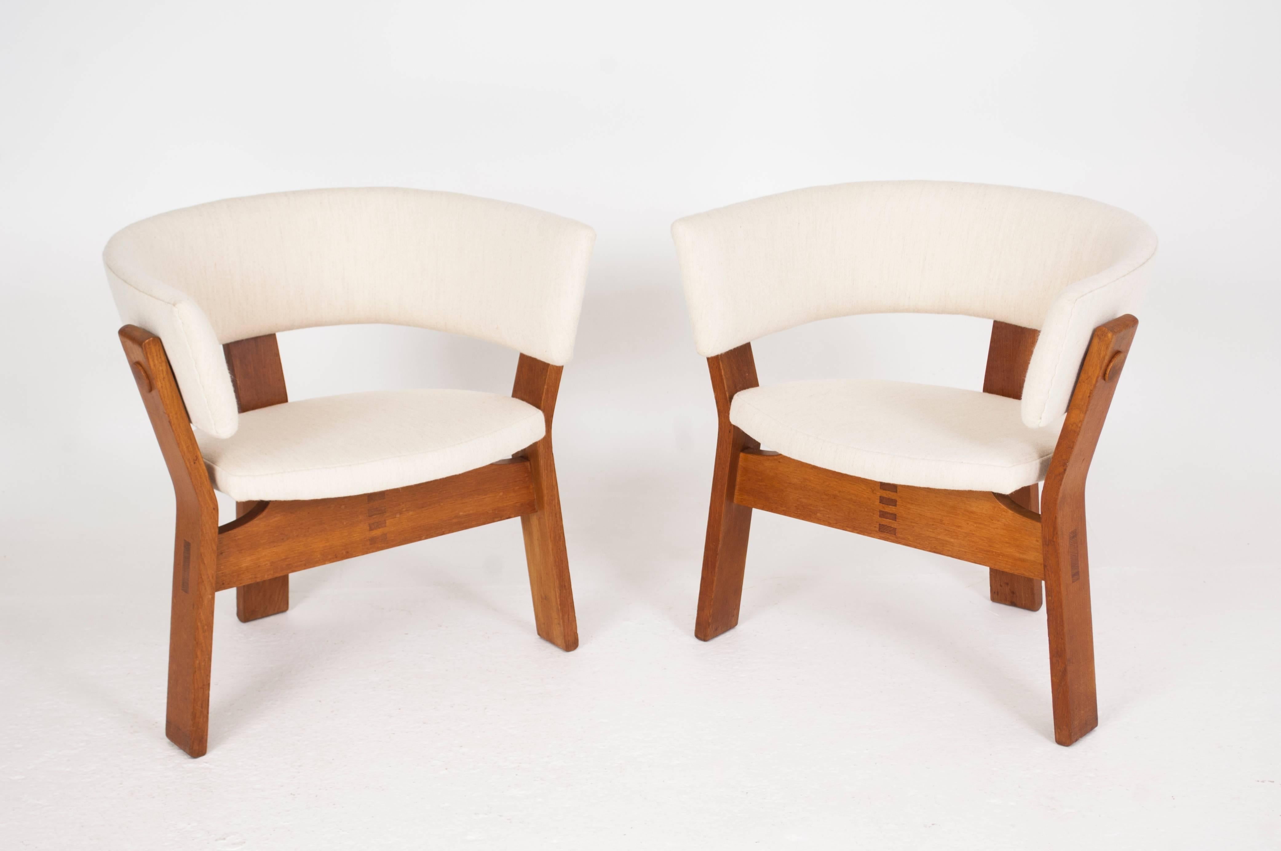 Steen Østergaard
 
Pair of oak armchairs with three legged base, seat and back upholstered.

Designed for the Danish Television   “TV-Huset” 1962

Produced by Stol-Ex.