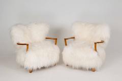 Fritz Schlegel (attributed) Pair of Easy Chairs in sheepskin and oak