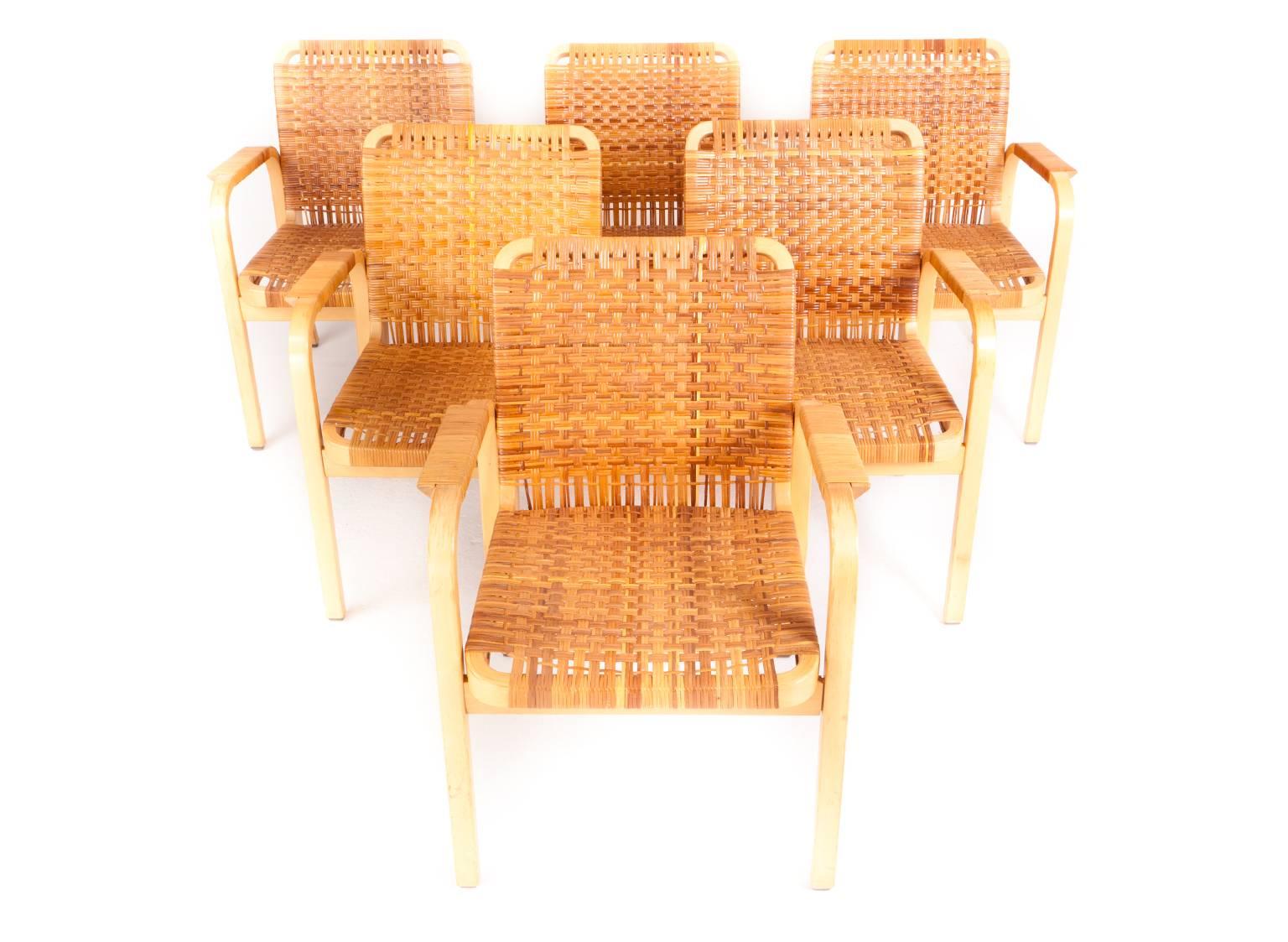 Alvar Aalto

Set of six armchairs made of laminated birch. Seat, back and arms with rattan.

Designed 1947.
Produced by Artek.
 