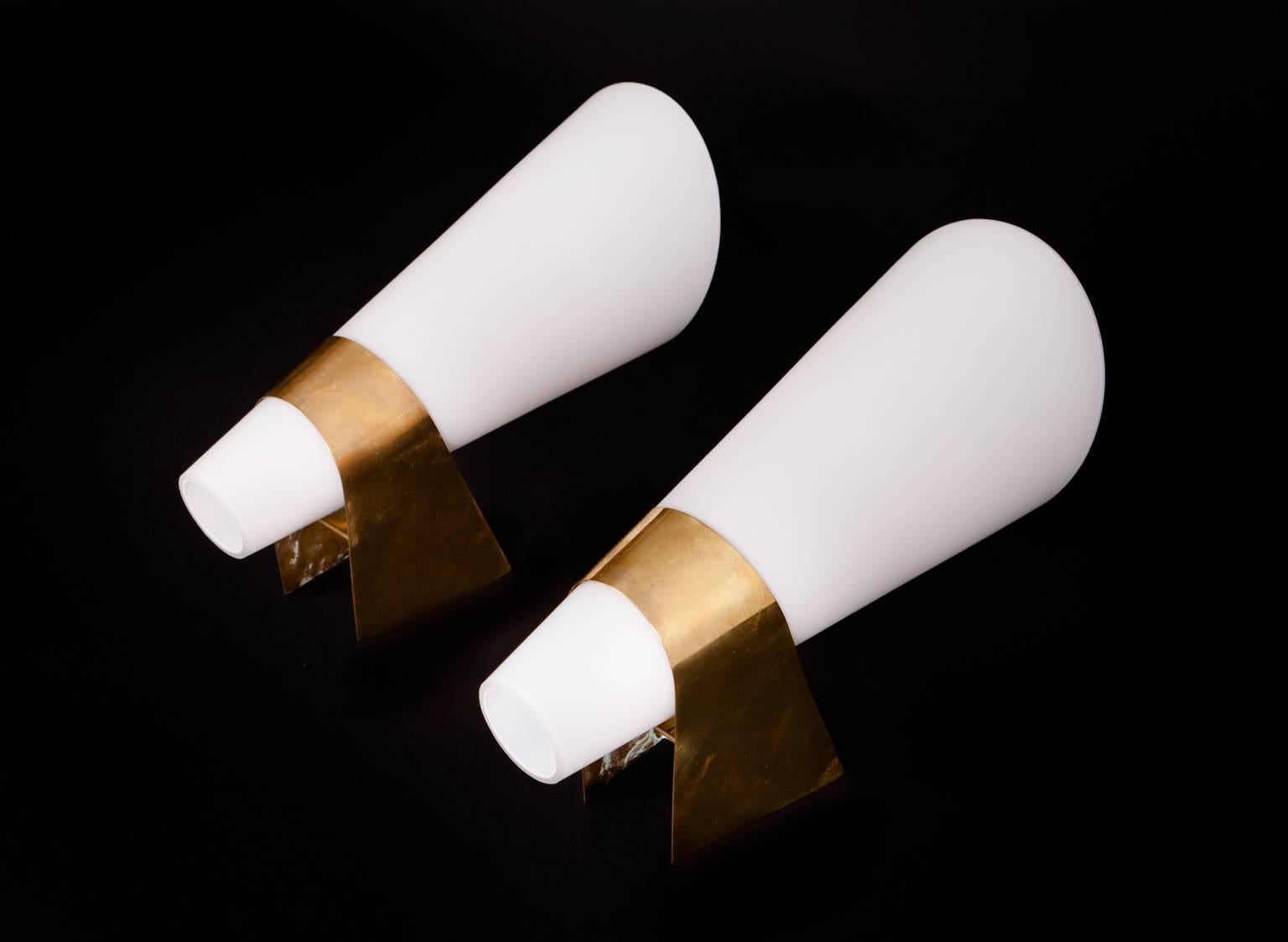 Pair of Scandinavien wall lamps in Brass with conic shades of opaline glass. 

  