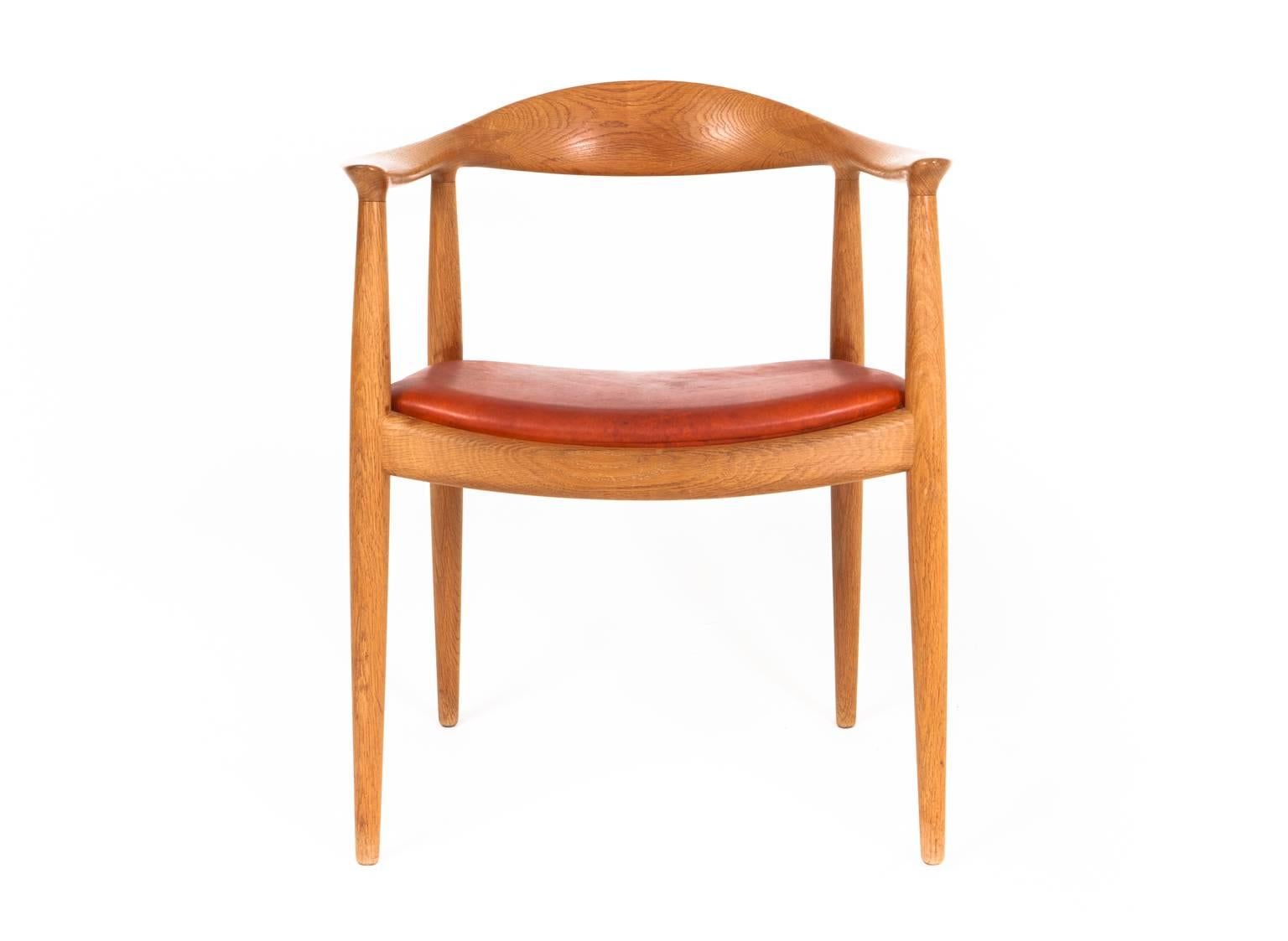 Hans J. Wegner

'The Chair'

Armchair with oak frame. Seat upholstered with natural red brown leather.

Model JH 503
Designed 1949. 

Made and stamped by cabinetmaker 
Johannes Hansen.