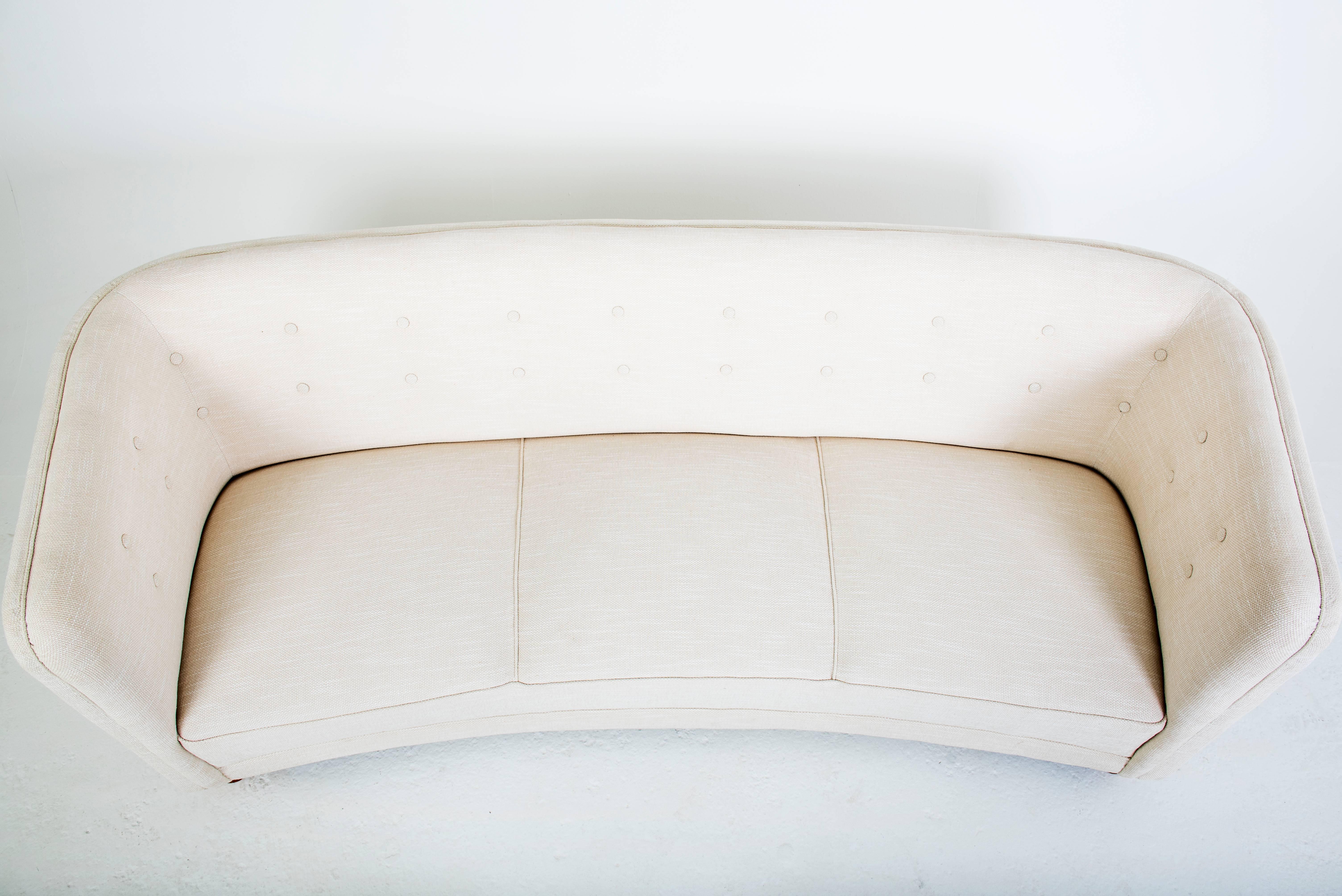 Ole Wanscher

Three-seat sofa with legs of beech. Upholstered with light fabric with buttons. 

Model 1668
Manufactured by Fritz Hansen 
Designed 1940s.