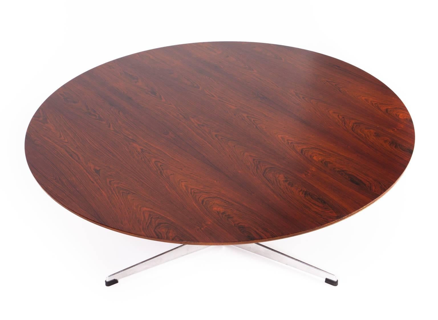 Arne Jacobsen

 Round coffee table with rosewood top, aluminium base on three-star foot with moulded stem.

 Designed 1958
 Produced by Fritz Hansen.