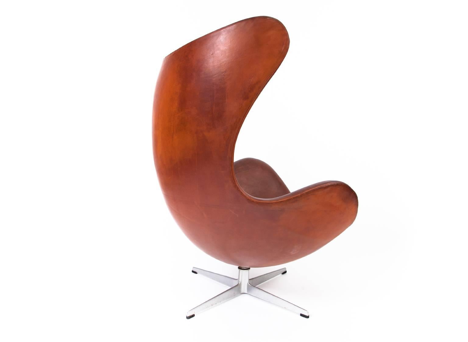 Danish Arne Jacobsen Egg Chair with Ottoman in Patinated Leather For Sale