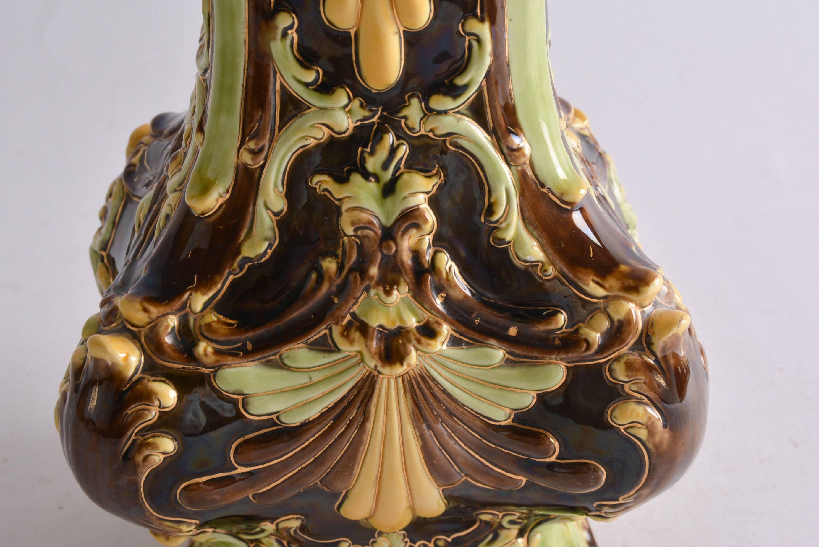 Art Nouveau Majolica vase by Julius Dressler, Biela at Bodenbach from 1900-1905. Inside pink exterior decoration in relief in brown, yellow, lime and gold details. Marked on the bottom JBD. 
Measures: Height 28 cm (11inches).