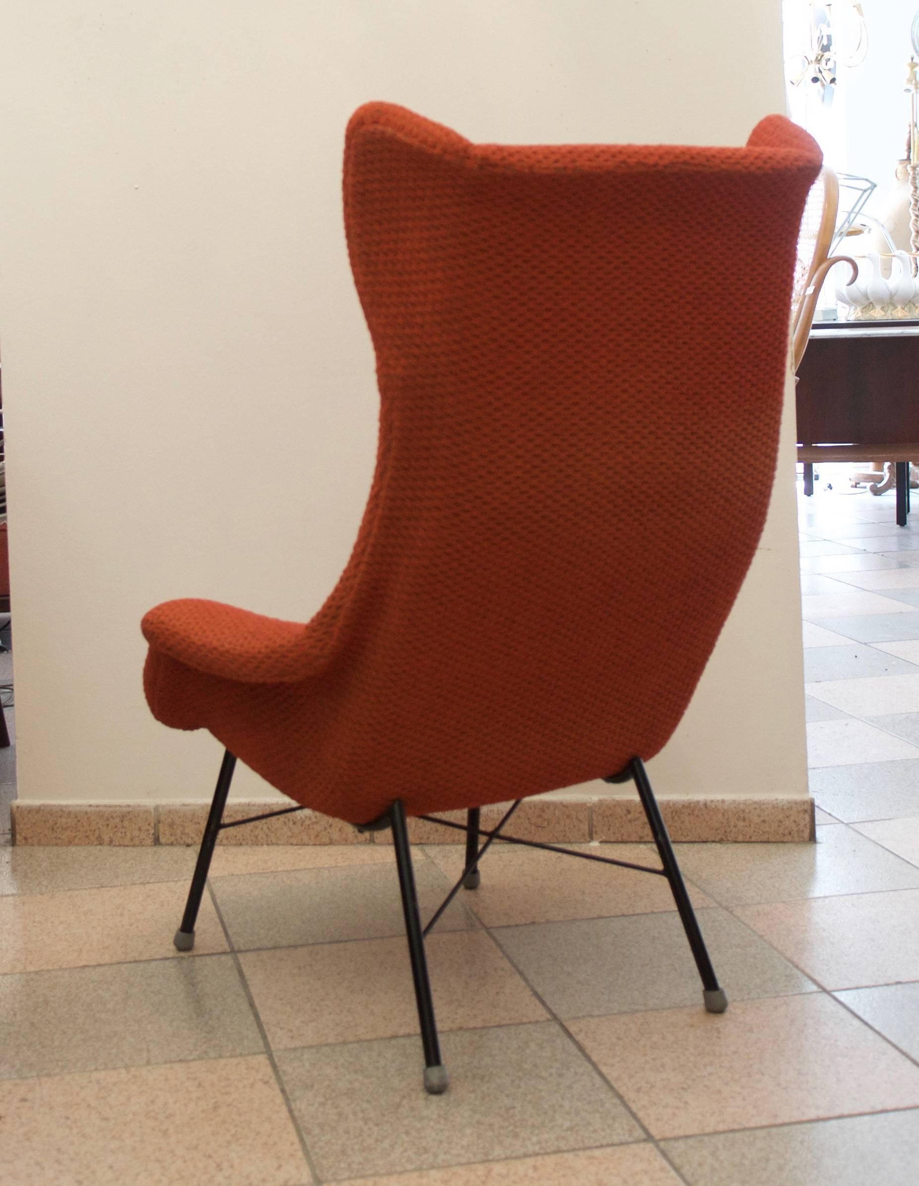 Wingback chair on steel legs designed by Miroslav Navratil for TON (formerly Thonet) in the 1960s. 
Really perfect original condition with stril original fabric.