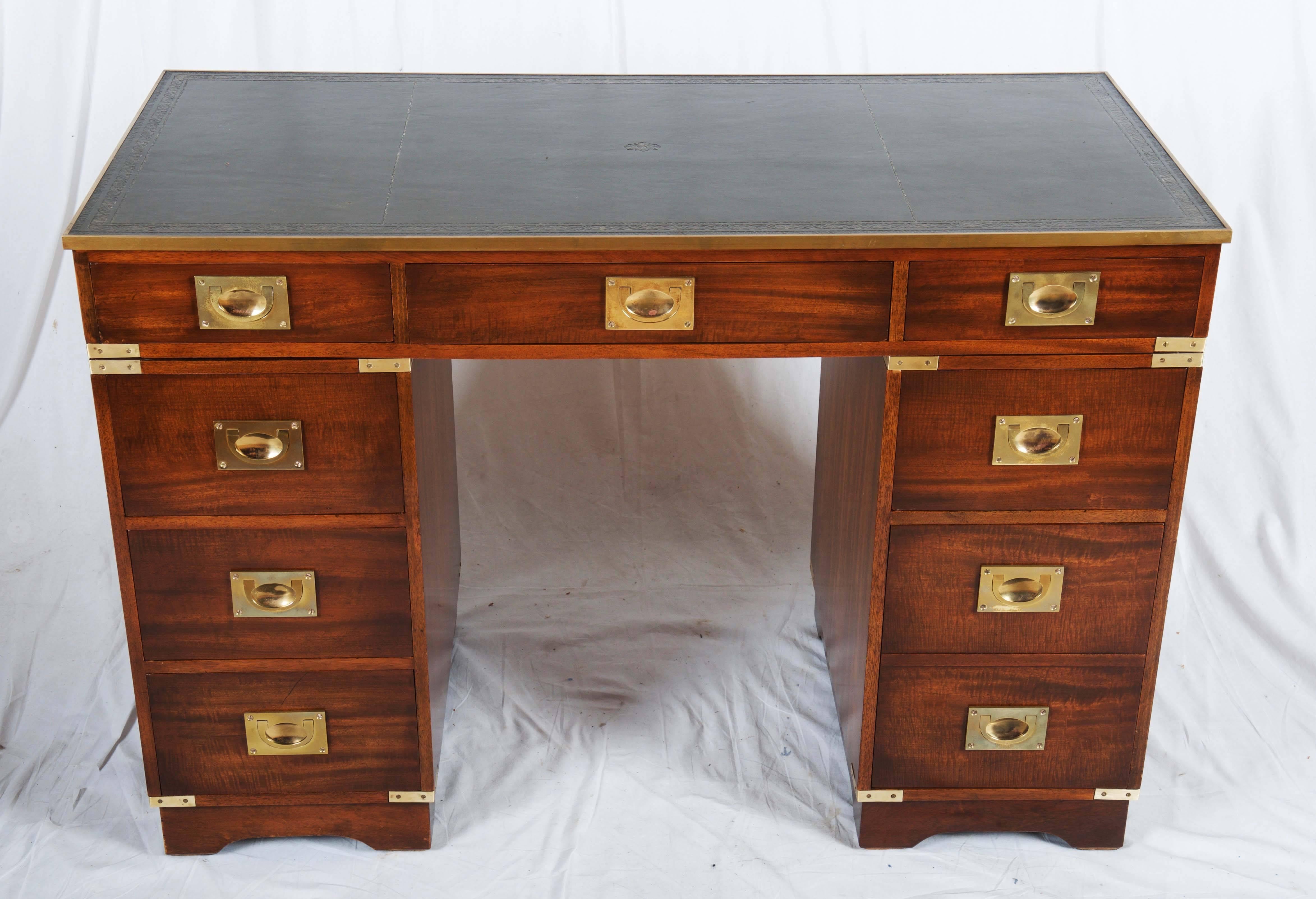 A three-part mahogany Campaign desk from circa 1950s.
It was already restored in the past, now just the surface was refreshed with shellac polish. Great proportions and a lovely design, brass Campaign hardware compliment the look.
 