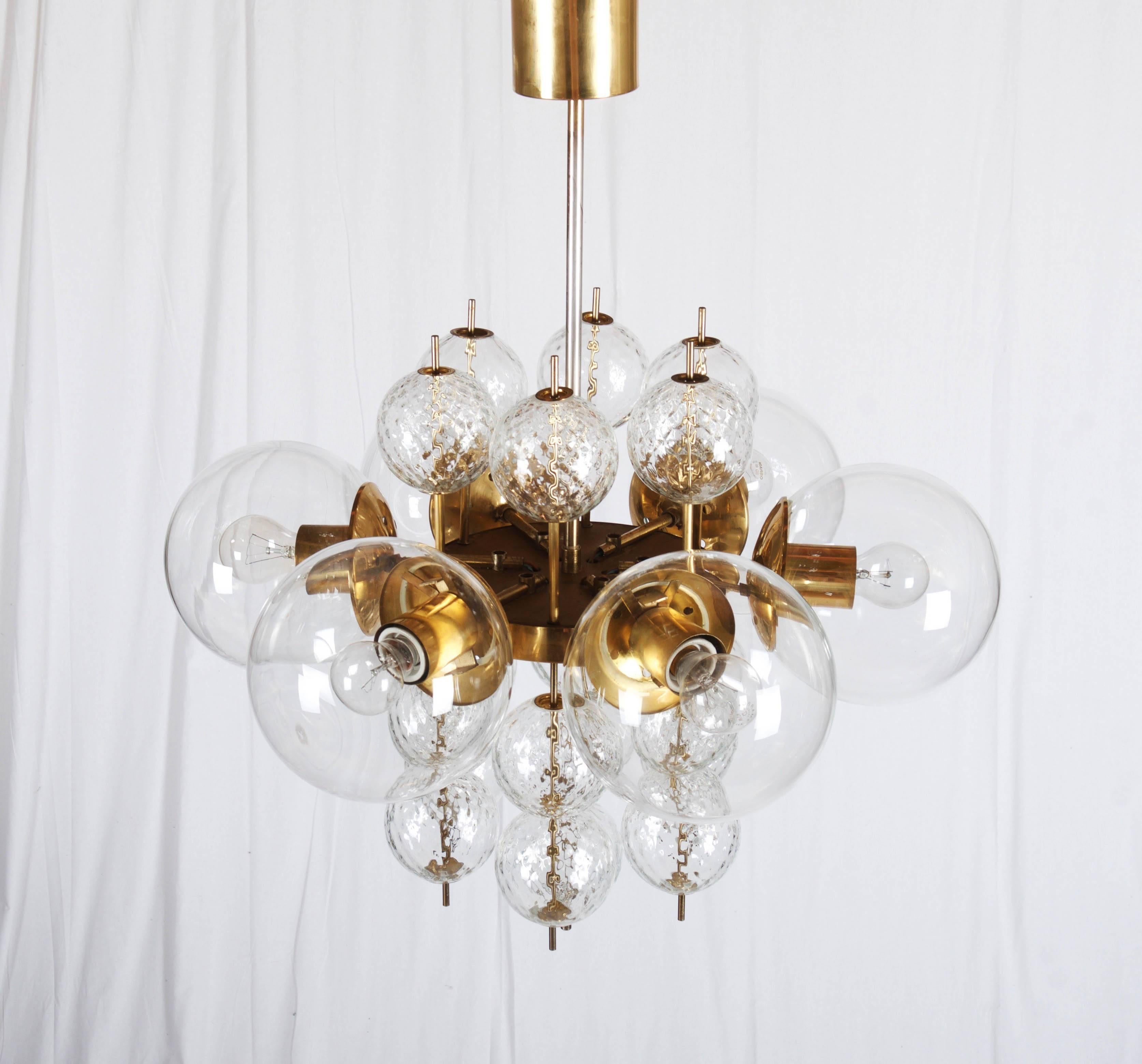 Beautiful large brass chandelier with six large and 19 structured small handblown crystal balls globes.
This chandelier was made by Kamenicky Senov in Czech Republic in the 1960s.
Perfect original condition with patina on brass parts.
two pieces