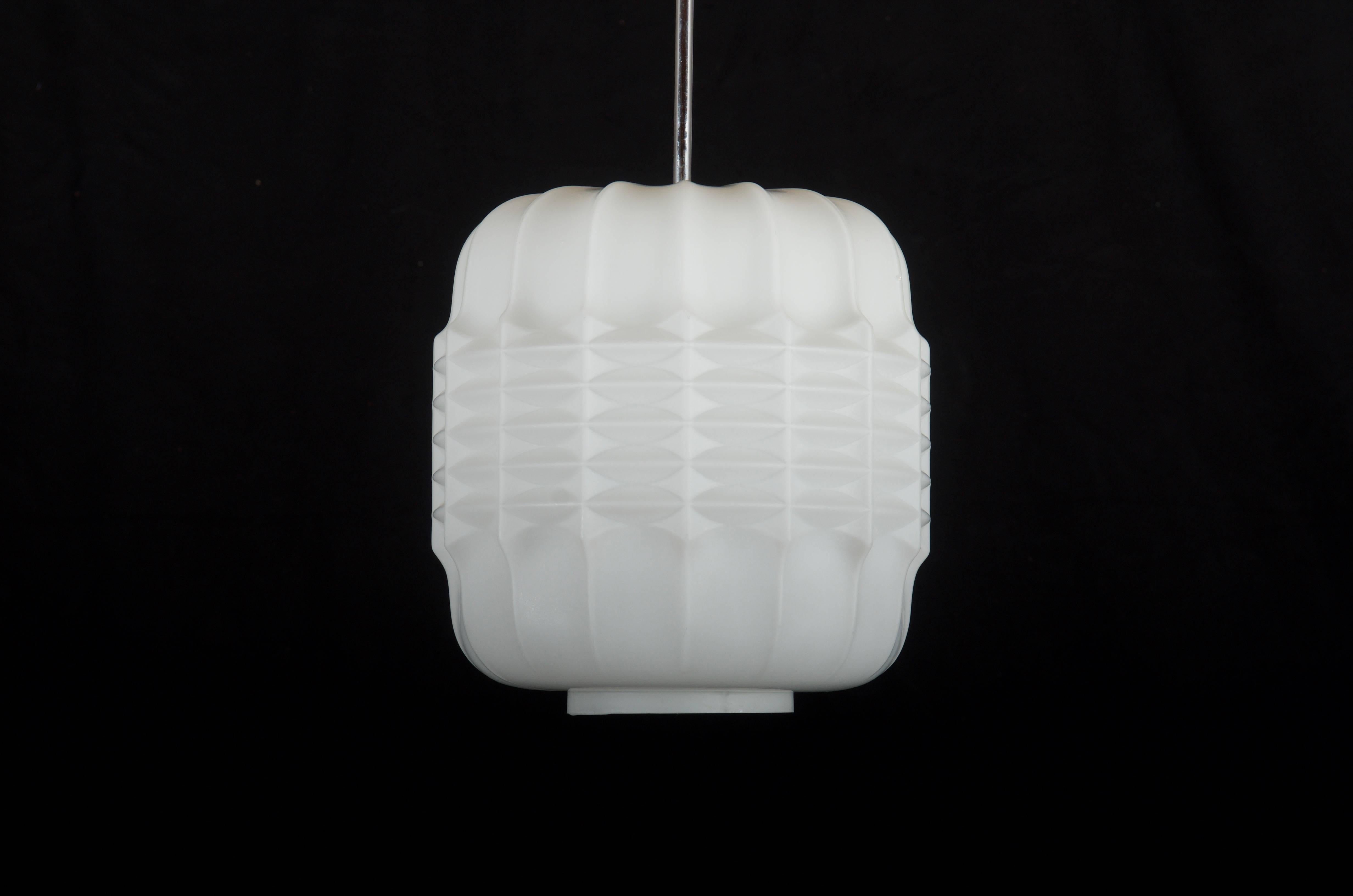 Structured opaline glass fitted with one E27 socket from the 1950s
up to 20 pieces available.