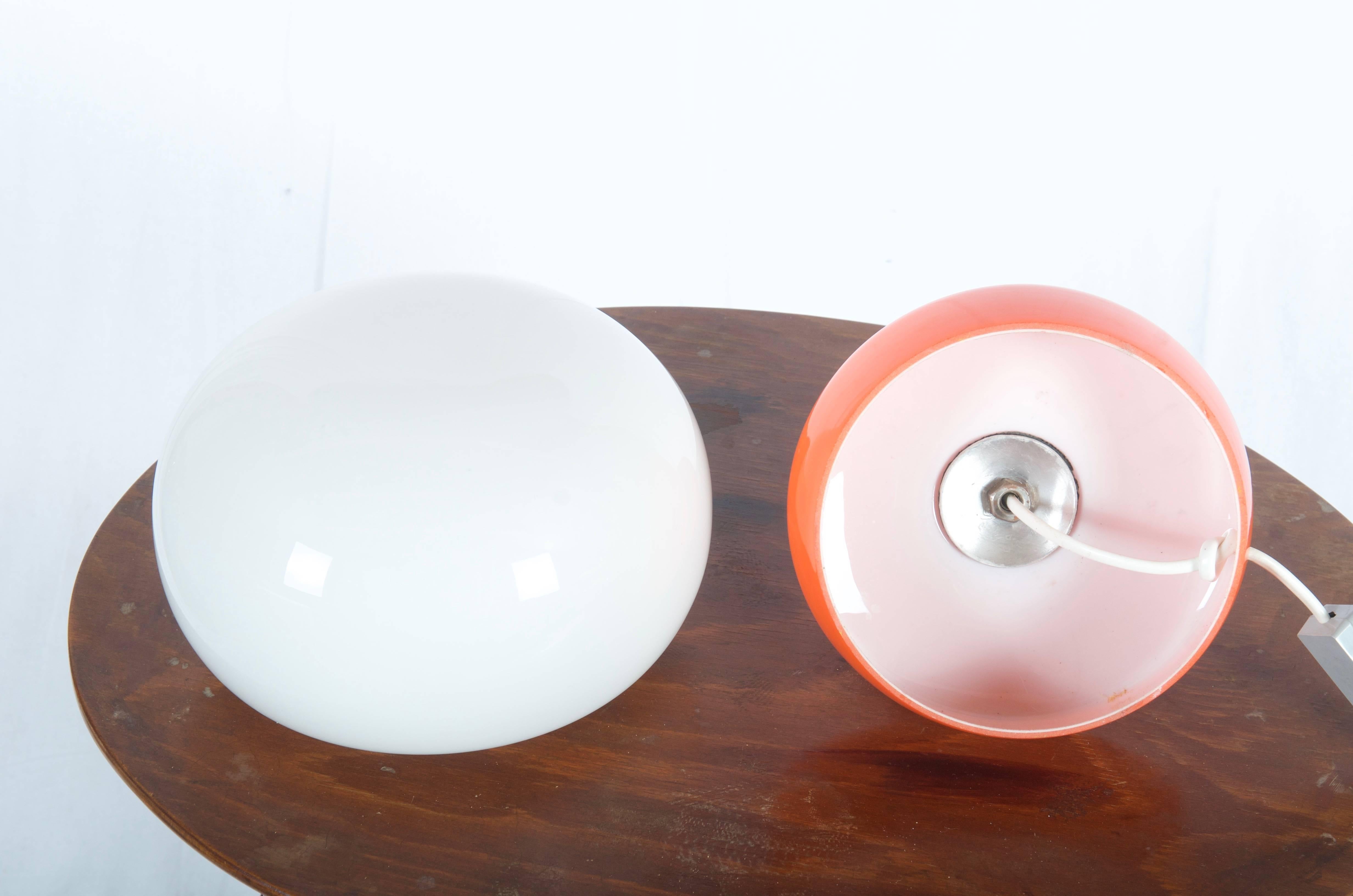 Glass table lamp from the 1970s made of double layered glass and fitted with one E27 socket.