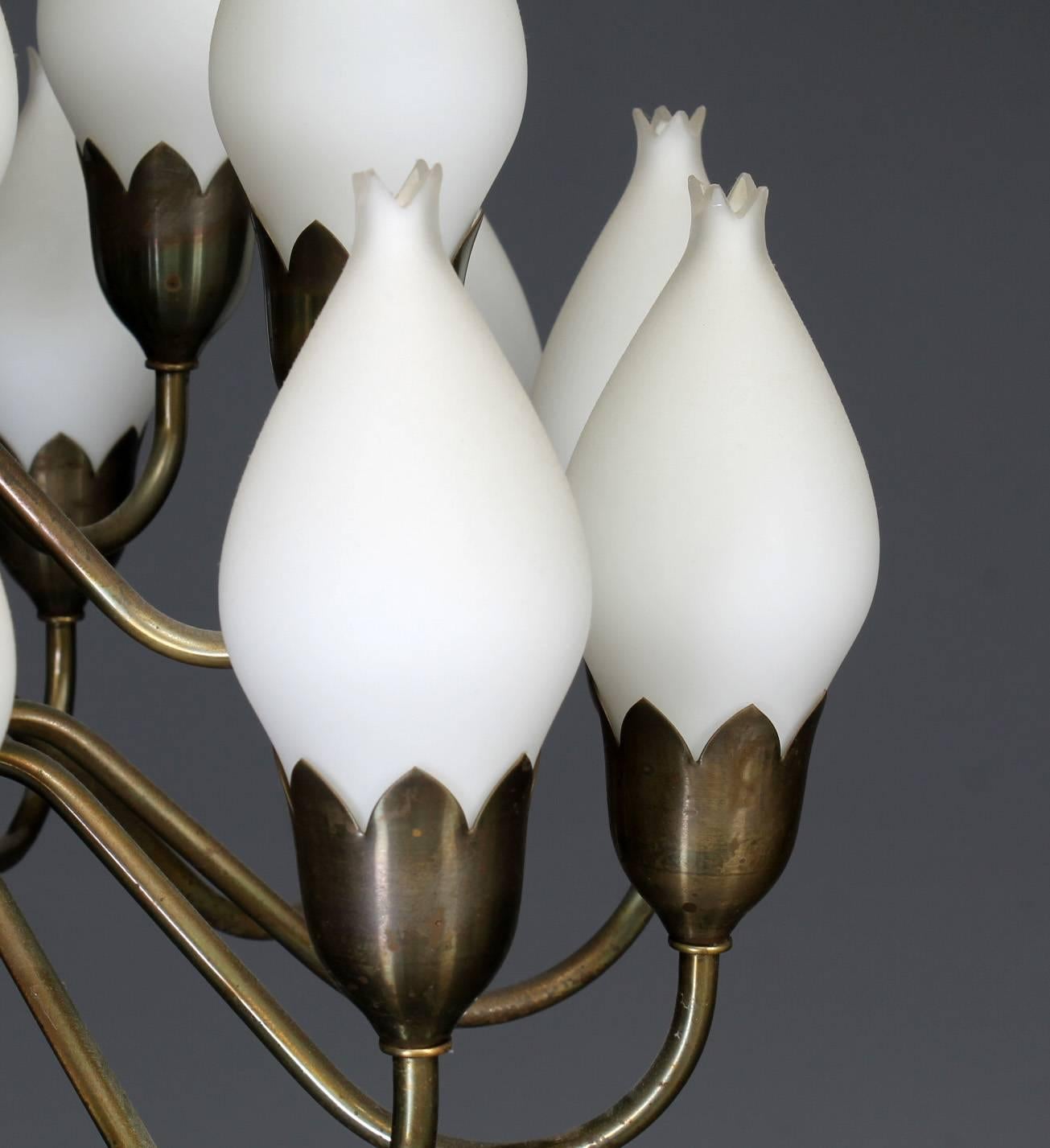 "Tulip" chandelier patinated brass on two floors, with 18 onion-shaped opal glass shades made in Denmark by Fog & Mørup in the 1960s.
 