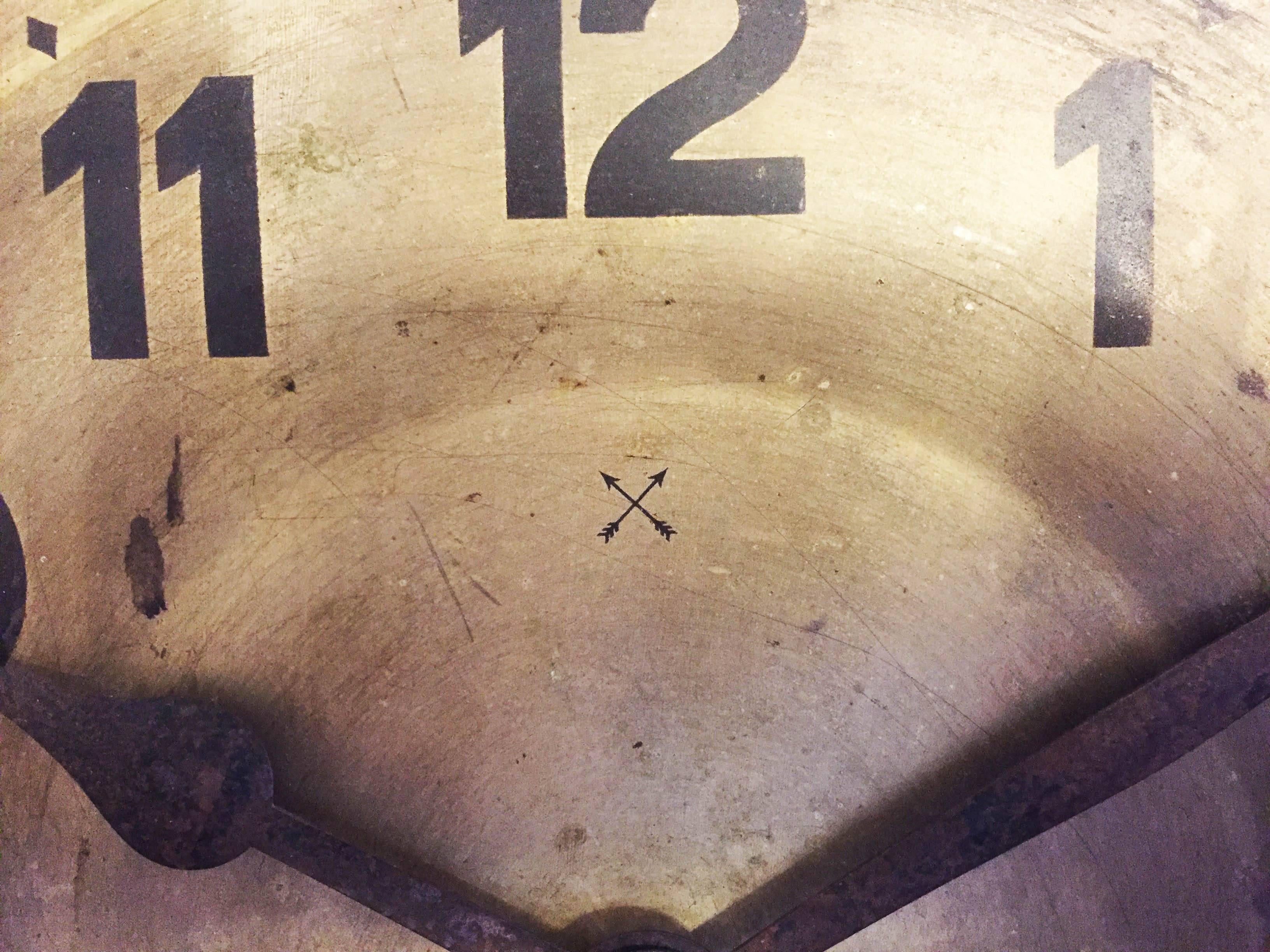 Glazed ceramic frame fixed with four screws on a wood frame with a steel clock face made by "Arrows Mark" or Hamburg-Amerikanische Uhrenfabrik (H.A.U.) (later Junghans) in the late 1920s. According to previous owner it was hanging in a