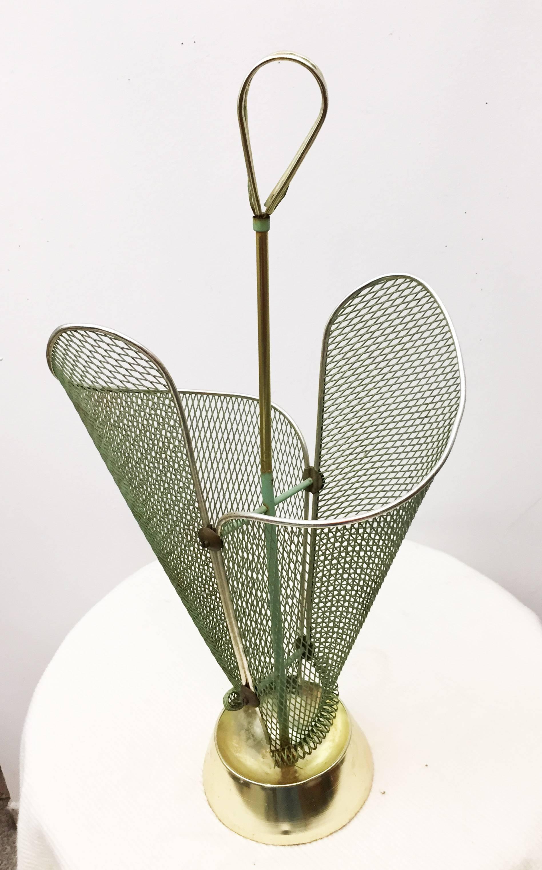 Brass construction with perforated green painted steel elements on a heavy cast iron foot. Made in Italy in the 1950s.