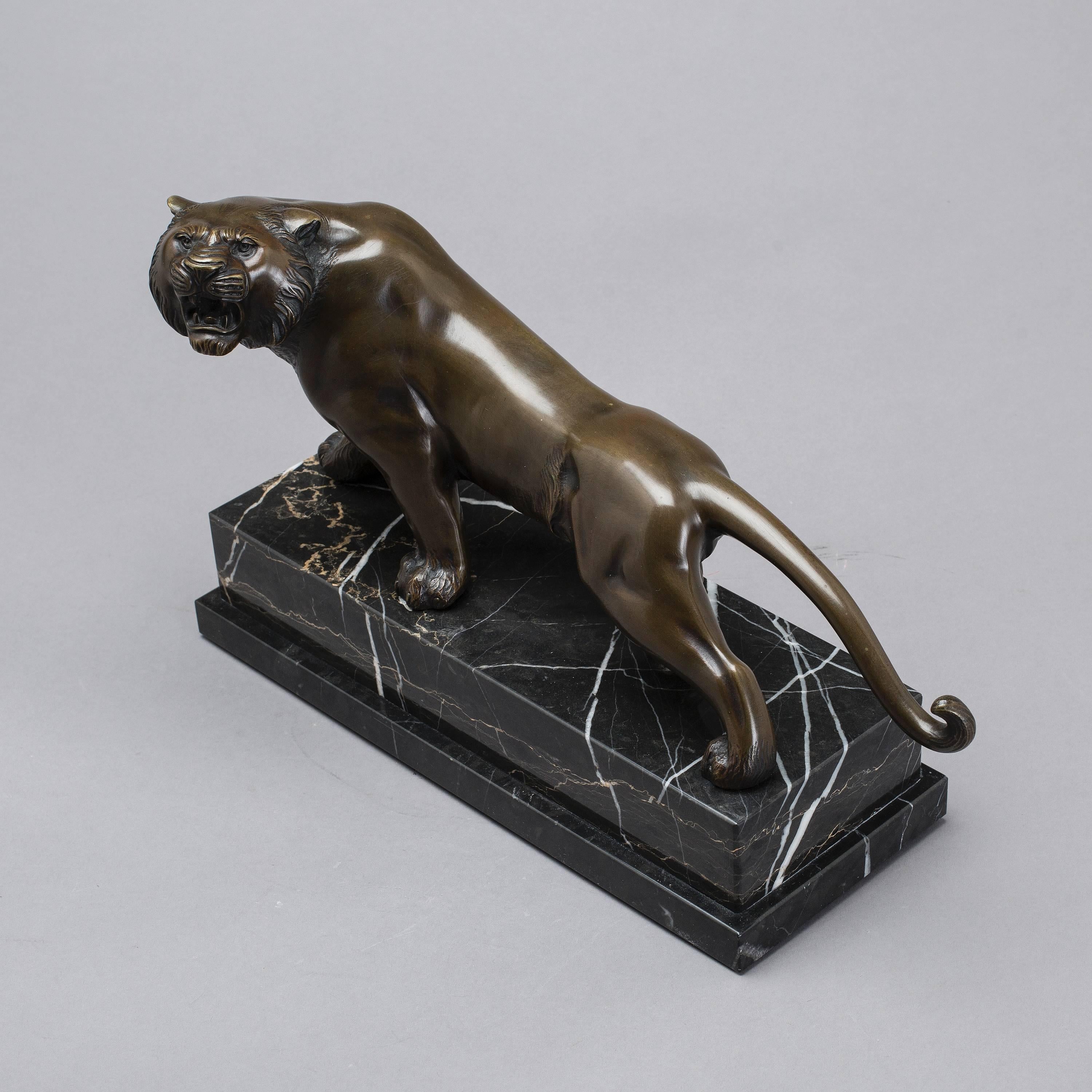 Heavy sculpture in the form of tiger, bronze plinth of stone, length about 39 cm. (15.35"). Good original condition.