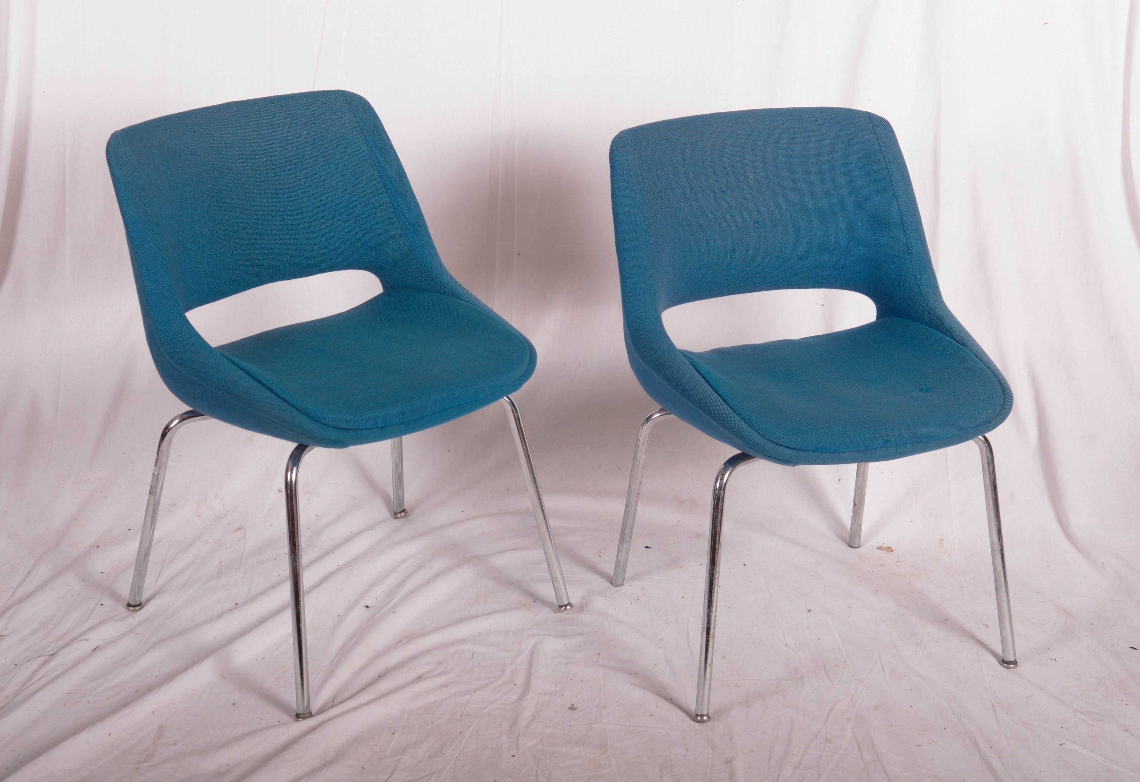 Upholstered with blue wool fabric on steel chromed legs, made by Olli Mannermaa in the 1960s for Martela Oy. 
Upholstery with hole on seat and back rest on one chair.
New upholstery or request available.