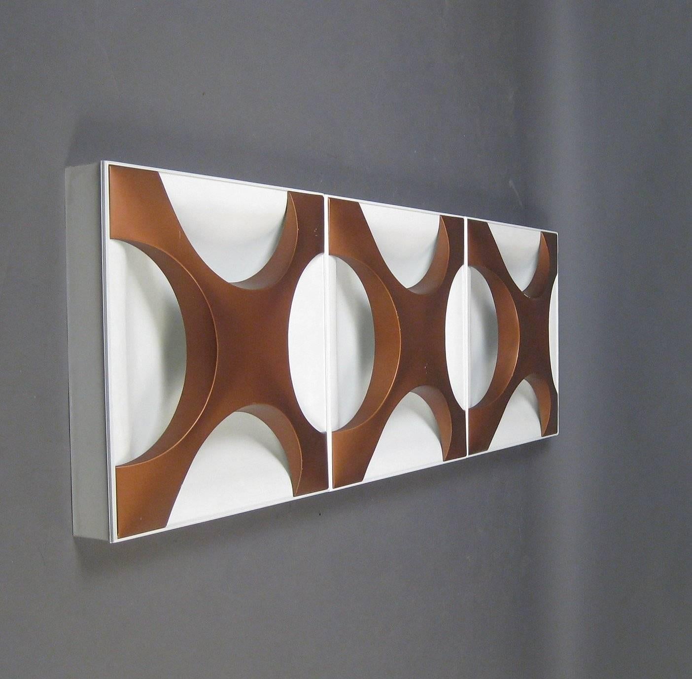 Ceiling or wall light model Oyster, German design by Dieter Witte & Rolf Krüger for staff. Design, circa 1968. Construction made of white lacquered steel sheet, covers copper-lacquered, equipped with four burners each. Partially labelled with