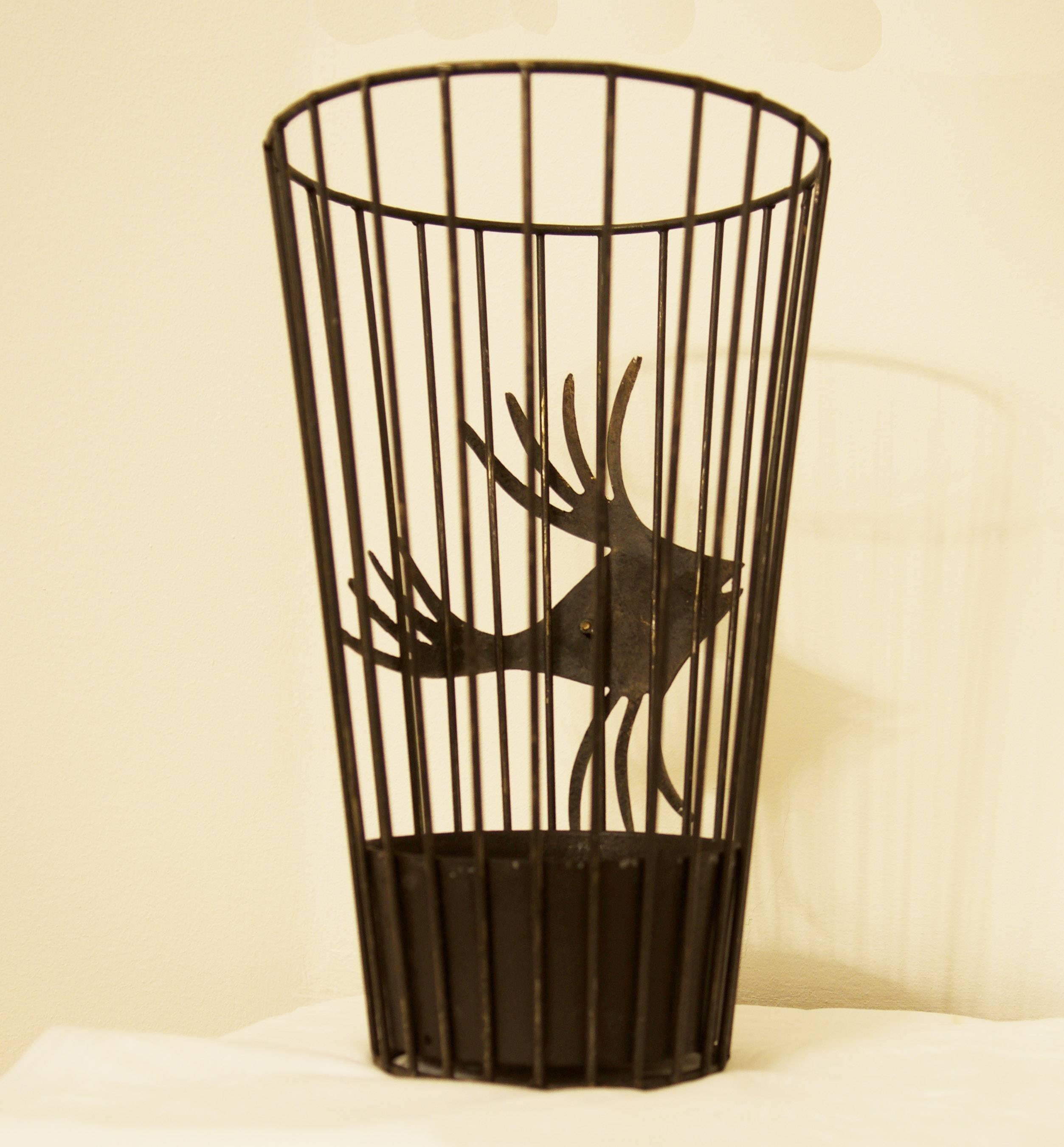 Steel basket with steel drip tray black painted with a brass fish outside the basket, designed by Walter Bosse in the 1950s for Hertha Baller.
 