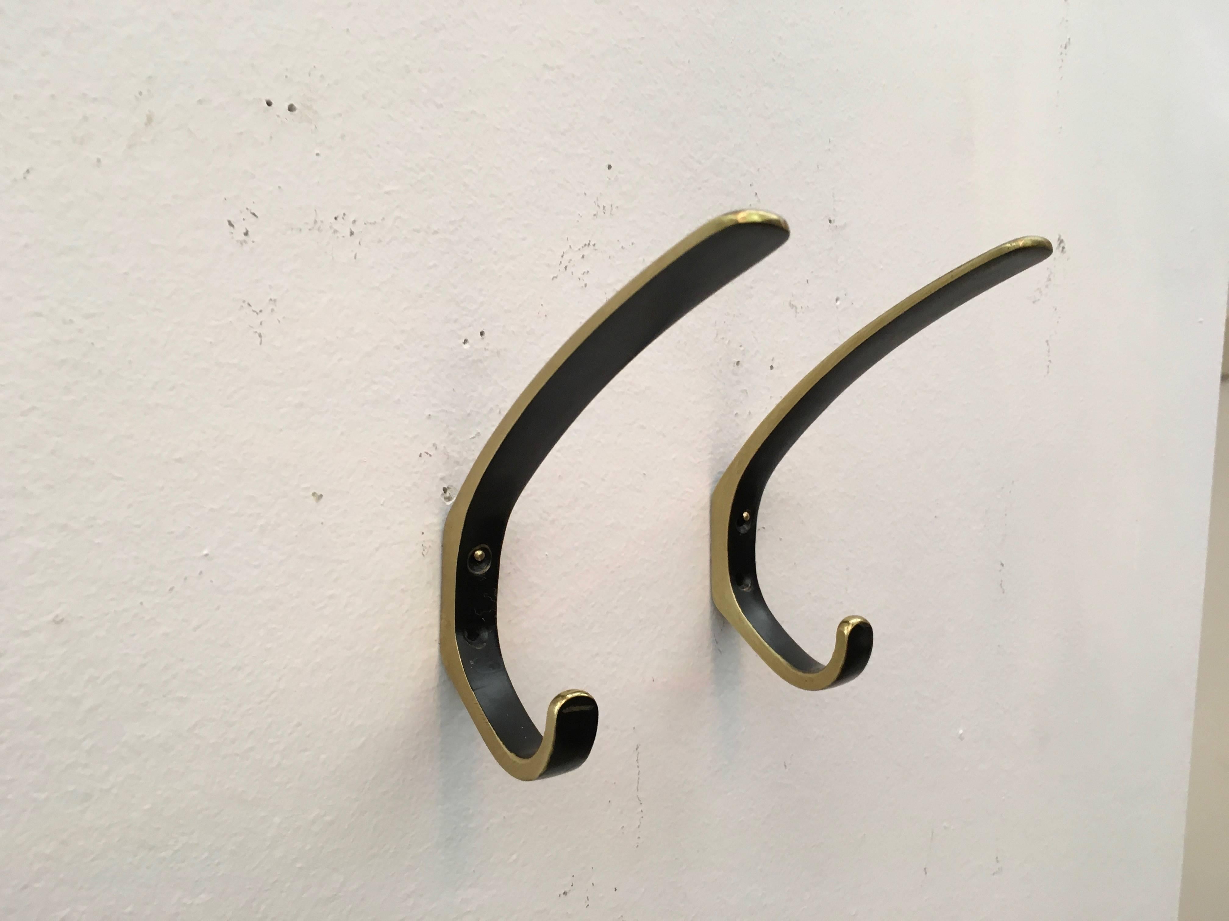Two beautiful Austrian brass hooks by manufactured by Hertha Baller in Austria in the 1950s.