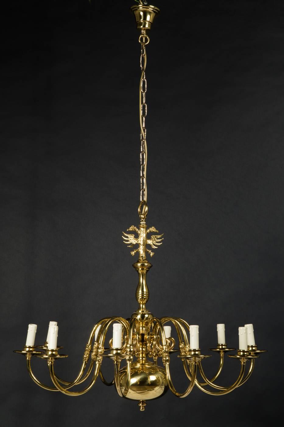 Chandelier in the style of a Flemish shank chandelier, made in 20th century in Austria, brass, polished, ten arms, S-shaped curved arms fitted with E14 sockets.

 