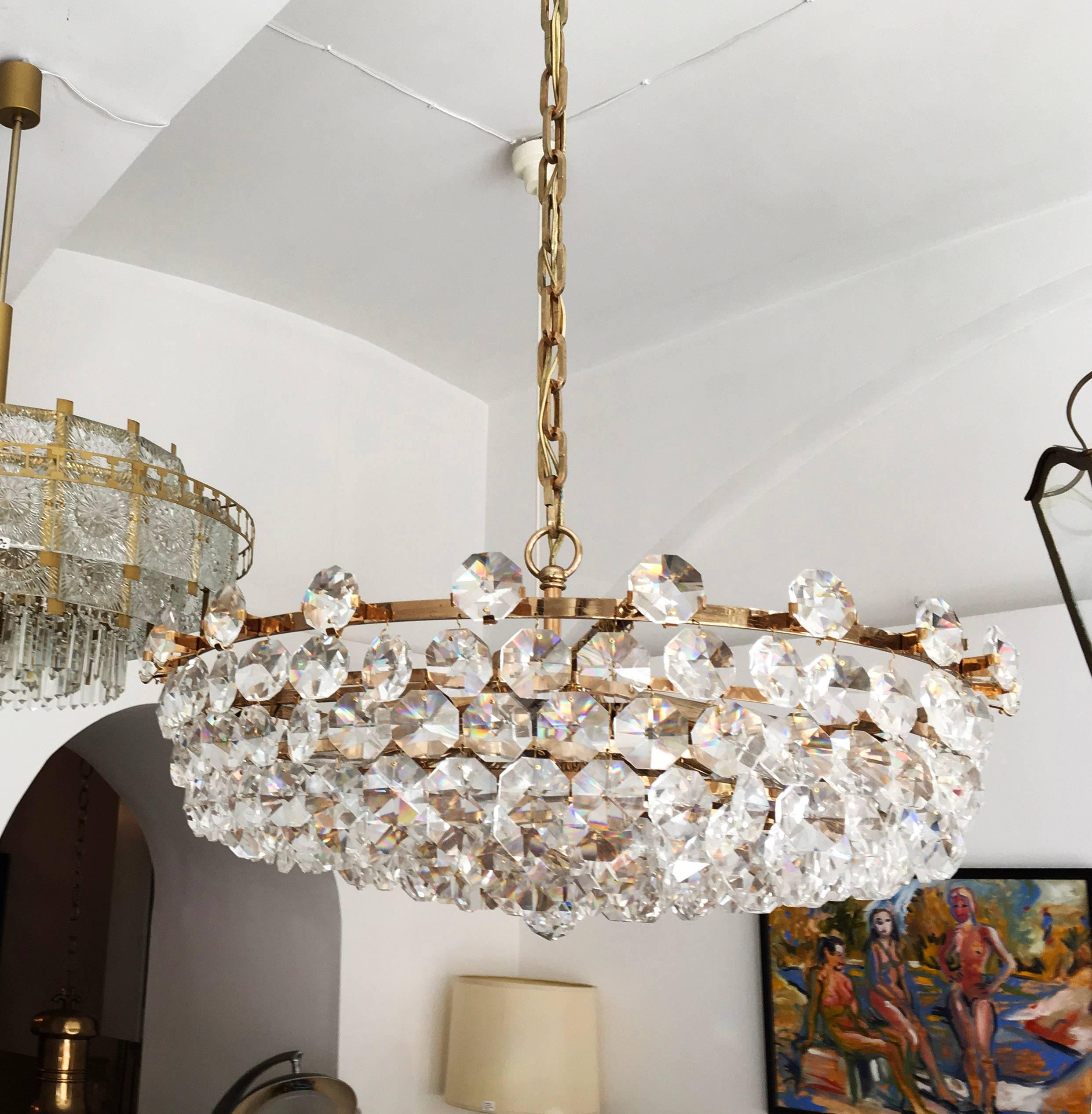 Brass frame gold-plated with 12 E14 bulbs and cut crystals by Bakalowits and Sohne from the 1960s.
Dimension the lamp only: 65 x 35cm (25.59 x 13.78 in).