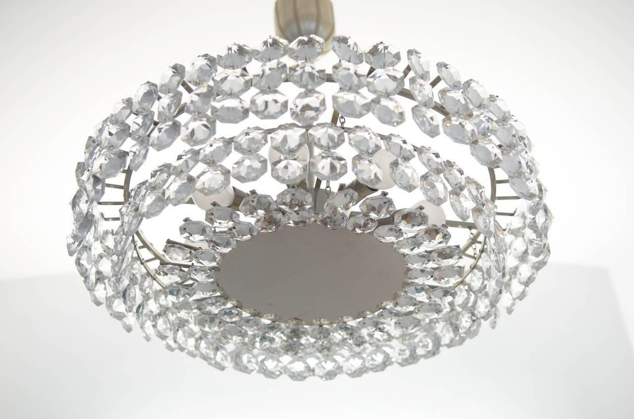 Impressive crystal chandelier from about 1960s by Bakalowits & Sohne.
Bras construction nickel-plated with eight lights sources with two circuits.
Dimensions: diameter 51cm (20.07in)
total height 60cm (23.62in) (on request also longer or