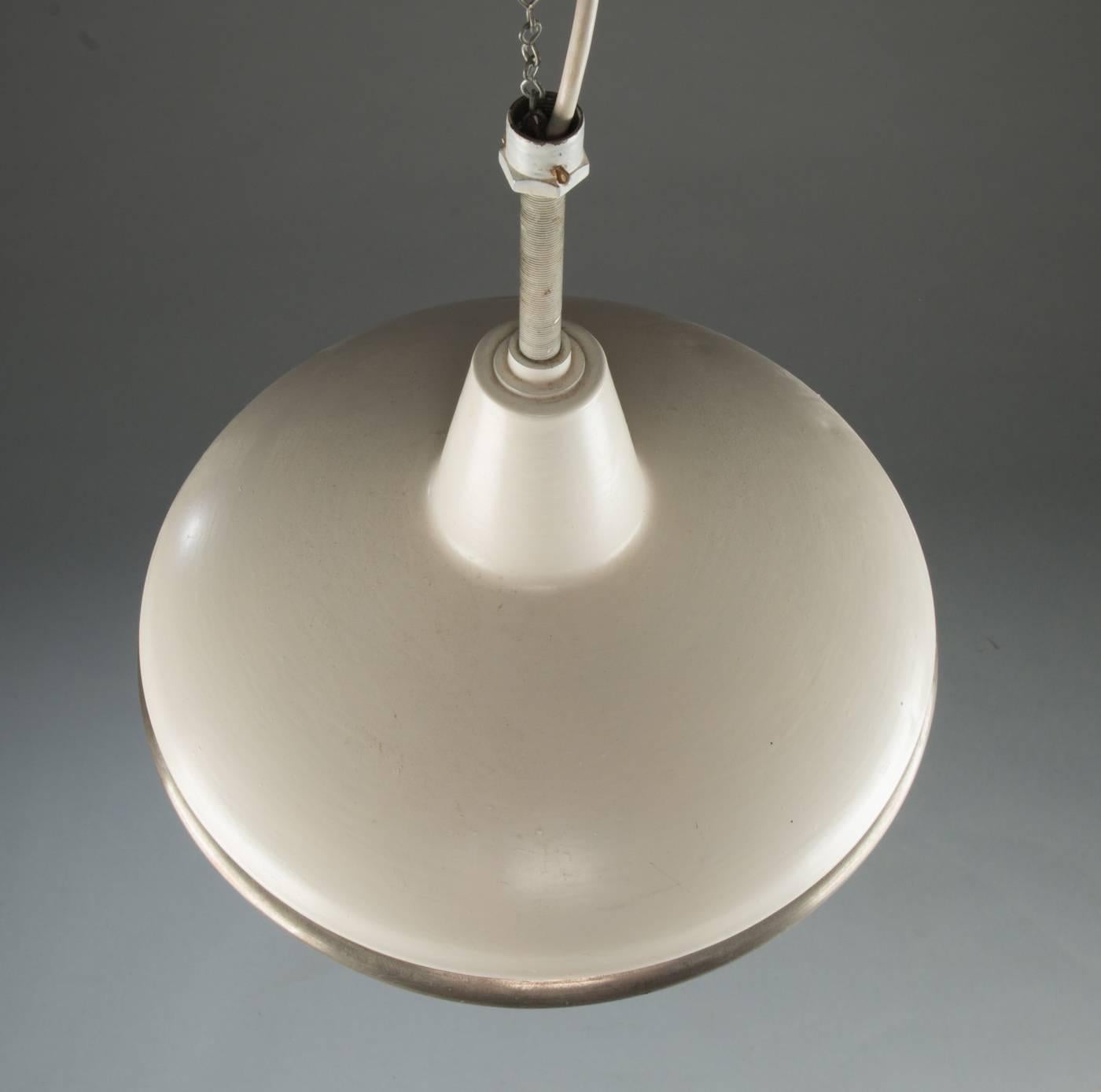 Sistrah pendant with opaline and clear/blue glass designed by Otto Müller 1931 in Germany. Fitted with one E27 socket up to 100 watts.
Perfect original condition.
Dimensions: diameter 35cm (13.77inch) total height customized.
Two pieces available. 