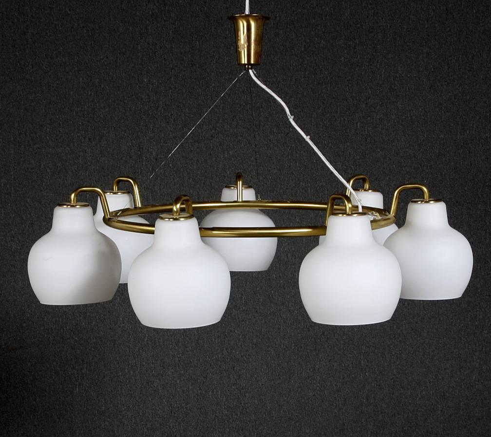 Brass construction fitted with e27 sockets and seven opaline glass shades, model "Christiansborg". Designed in the 1950s for Louis Poulsen.
Fully restored, up to three pieces available, delivery time about 2-3 weeks.
The total heigh will